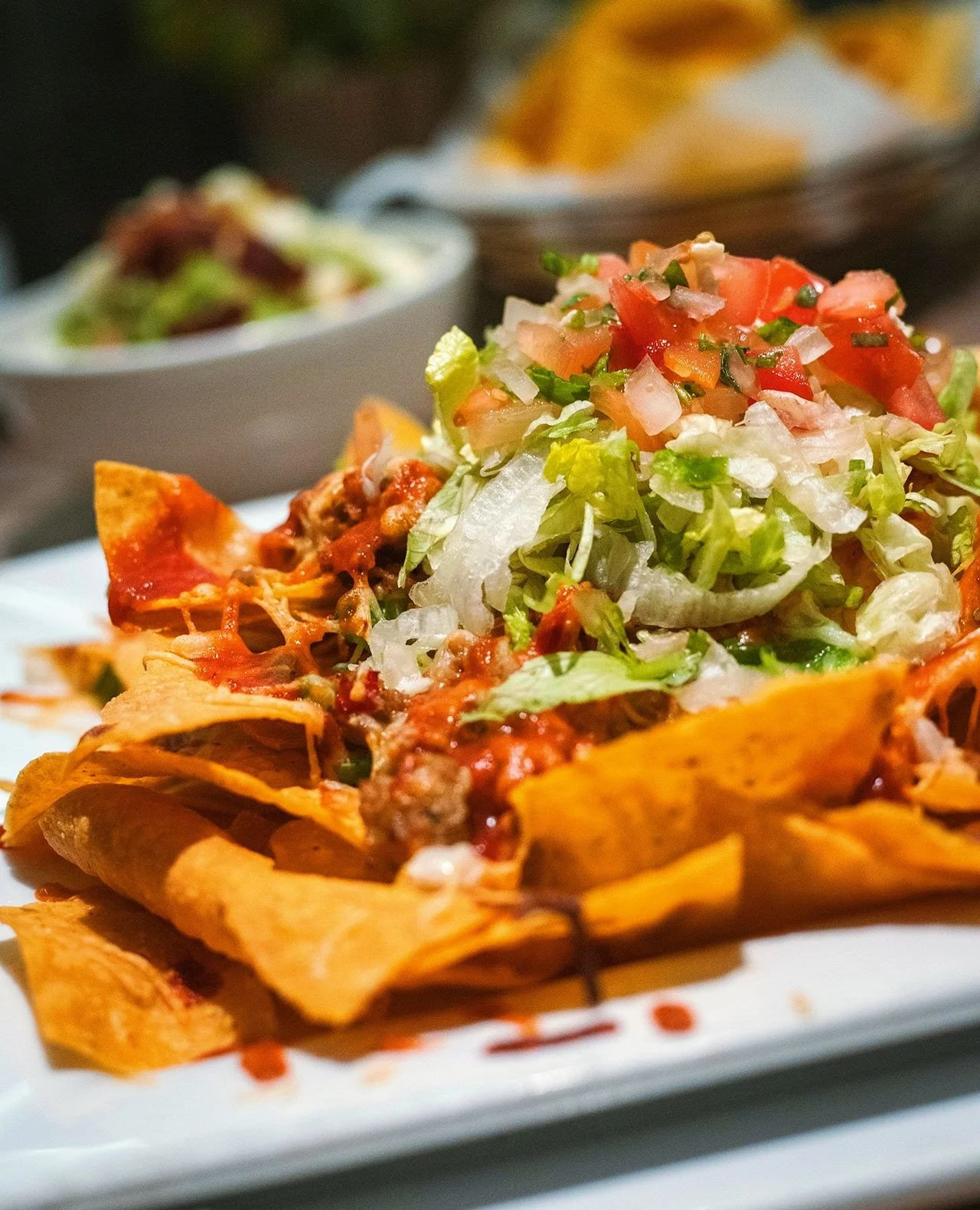 Imagine not trying chef's Italian Sausage Nacho special. Could never be me.⁠
⁠
Ground Italian sausage, peppers, onions, cheddar, parmesan, chipotle tomato sauce, lettuce, pico, crema⁠
⁠
Limited time only!