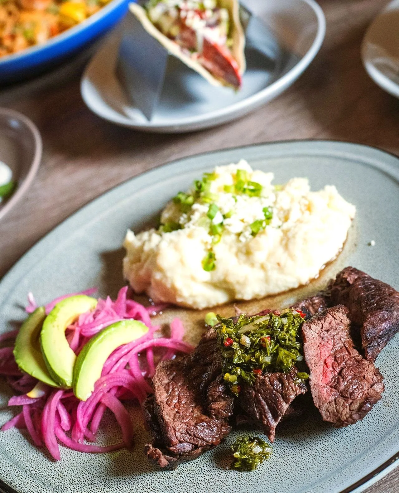 Meet your Memorial Day weekend move: CARNE ASADA 🔥⁠
⁠
Grilled sirloin bavette layered with chimichurri verde, creamy mashed potato, sliced avocado, queso fresco, and pickled red onion. ⁠
⁠
Bold, bright, and built for a long weekend.⁠
⁠
Open all week