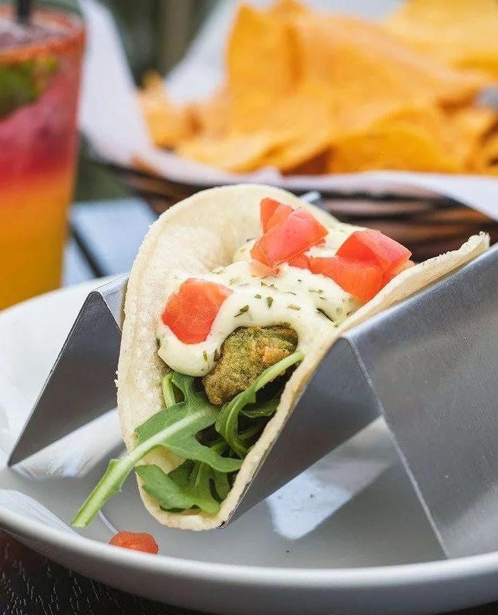 Any time, any place. Or specifically...Now...at Mezcal.⁠
⁠
🥑 Fried Avocado Tacos &ndash; arugula, diced tomato, herb aioli