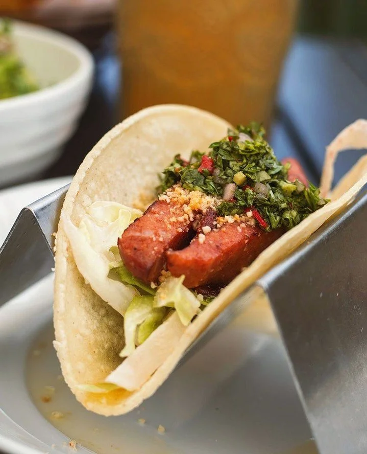 Taco Tuesday has a new favorite.⁠
⁠
This week&rsquo;s special features grilled lingui&ccedil;a topped with spicy cotija cheese, chimichurri, and crisp lettuce. Smoky, herbaceous, and just the right amount of heat.⁠
⁠
Available tonight at Mezcal.