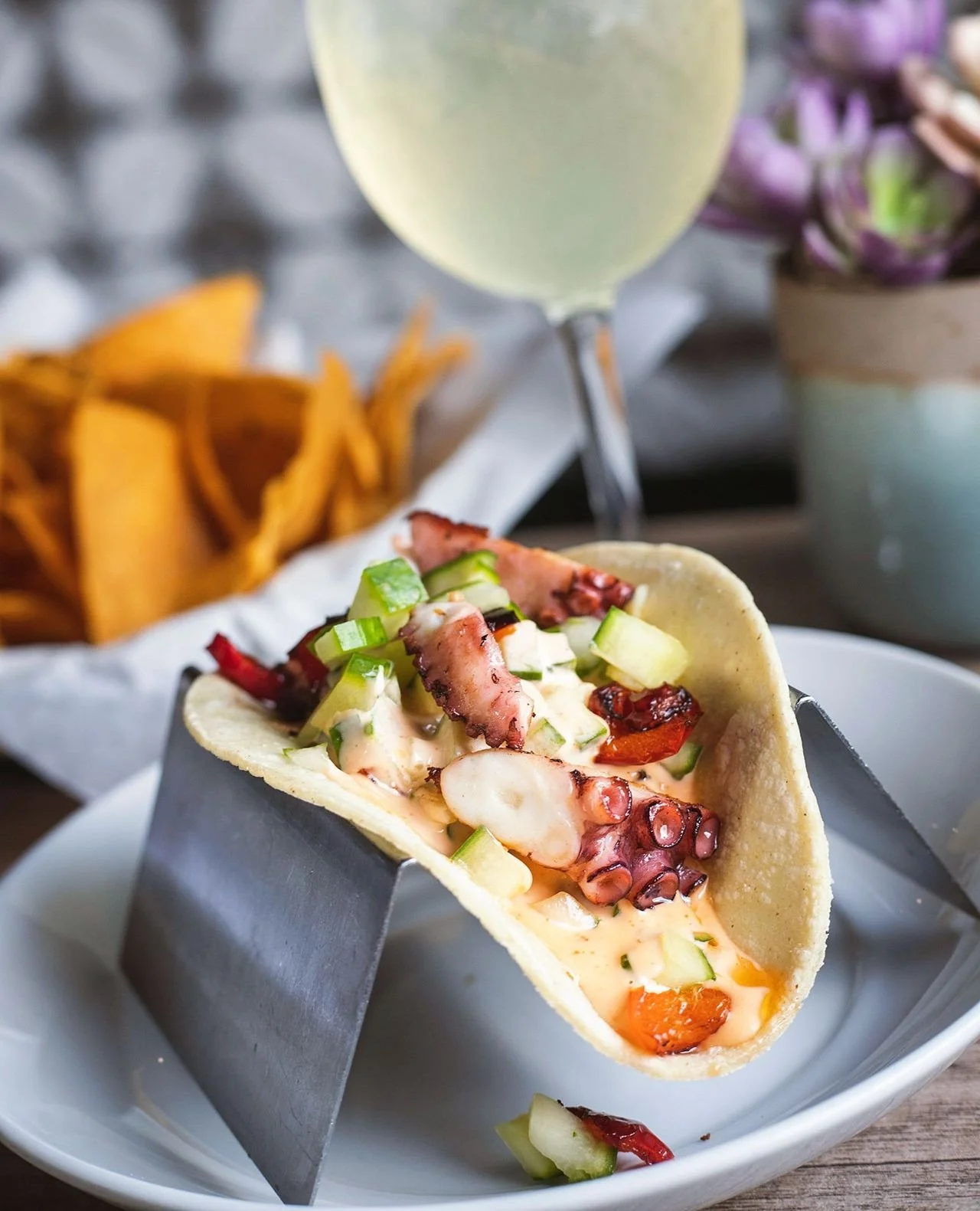 They may not be for everyone...that just means more for us 🐙⁠
⁠
A little taste of the coast, tucked into a tortilla. Our Octopus Tacos pair tender octopus with crisp cucumber, red bell pepper, and a kick of sriracha aioli for a taco that&rsquo;s bri