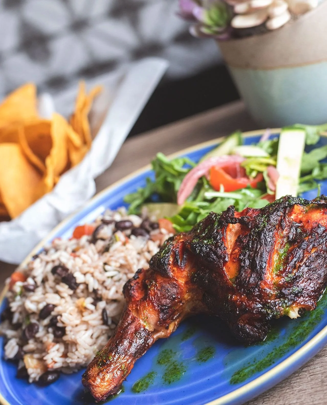 Your week could use a little more Mezcal.⁠
⁠
Chef&rsquo;s latest special: Chipotle Guajillo Chicken over rice &amp; black beans with arugula salad and scallion-parsley oil.⁠
⁠
Available for a limited time!