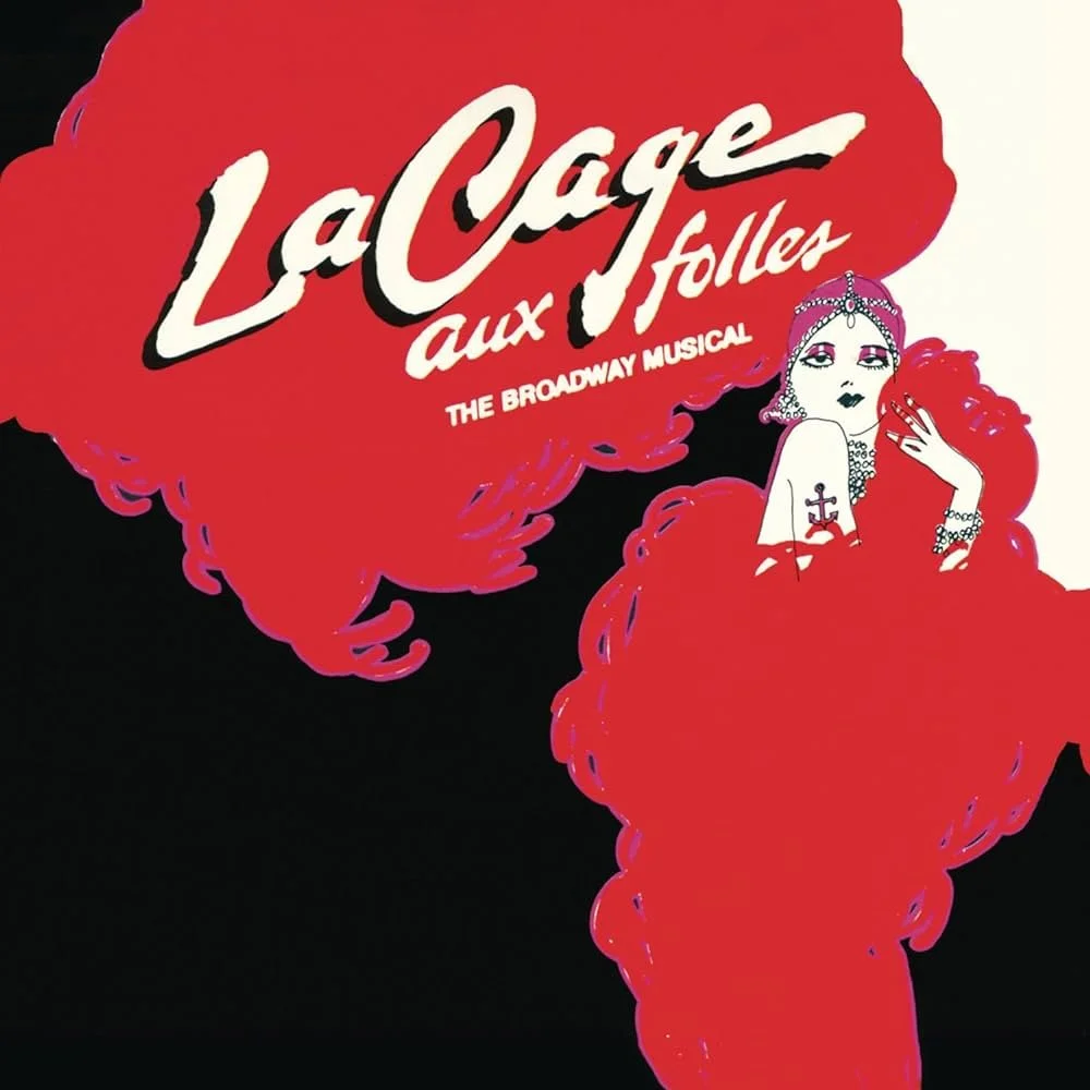 Poster for the Broadway musical 'La Cage aux Folles' featuring a stylized drawing of a glamorous woman with jewelry and a cross tattoo, with bold red and black colors.