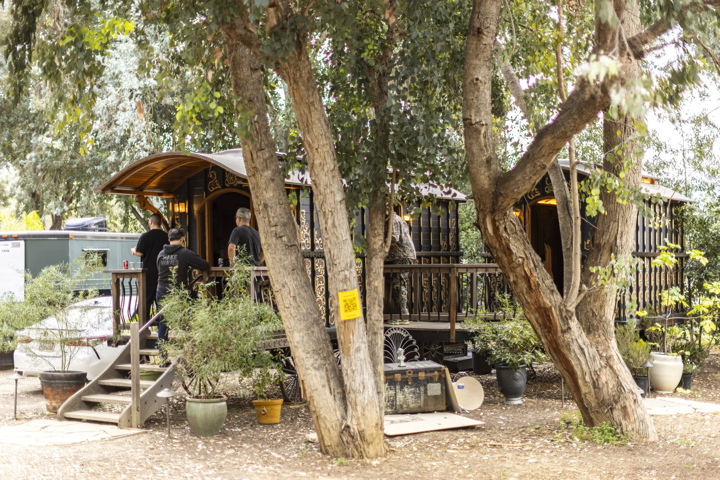 Gypsy Wagons under the trees at Elsewhere provided housing for visiting creators. 