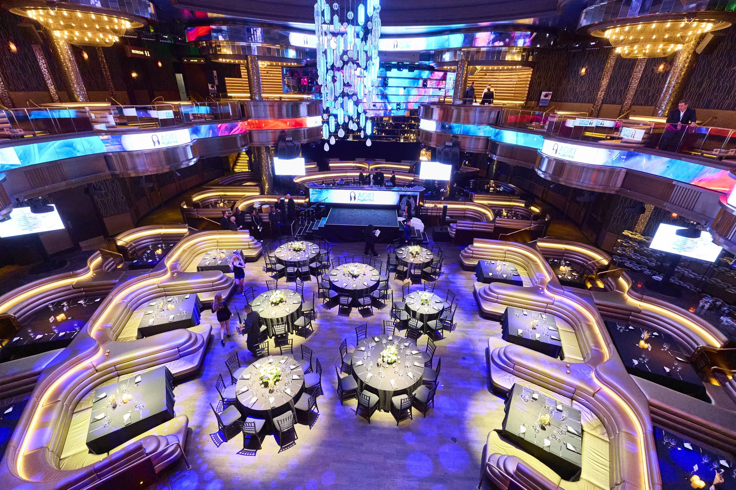 The Aoki Foundation Charity Gala fused high-energy nightlife with elevated philanthropy, featuring Steve Aoki performing on a vibrant LED stage amid a sleek, multi-level venue. Red-carpet arrivals, glowing tablescapes, and concert-style lighting crea