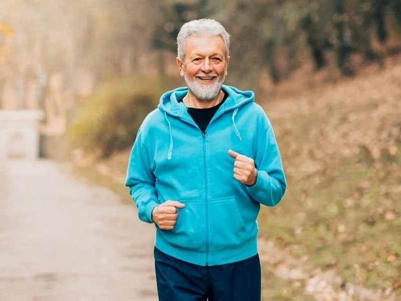 Older man jogging to keep up with his health after his HBOT session at ATX