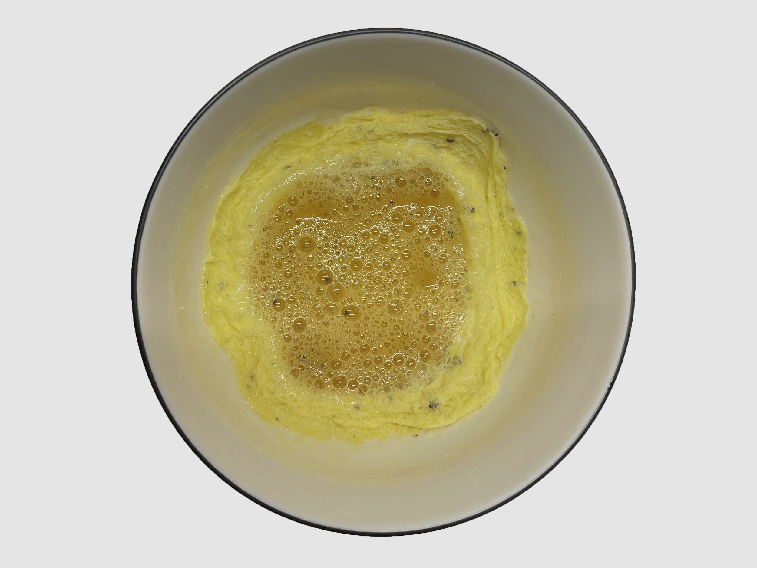 6. There will be a ring of cooked egg on the peripheral of the bowl surrounding the liquid center