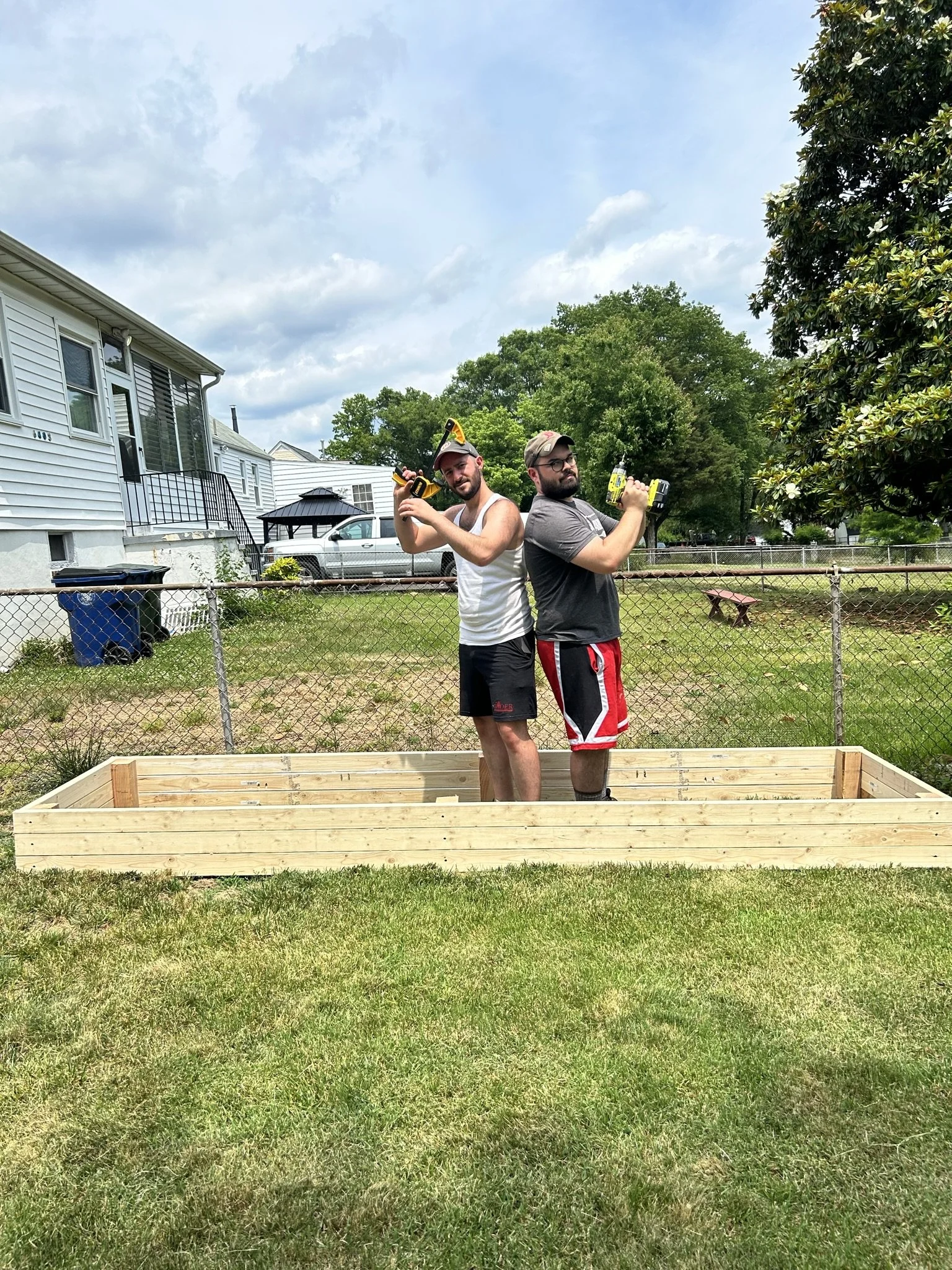 Jon and David building flowerbeds in Carrie and David's backyard. 

Submitted by Madeline Belknap