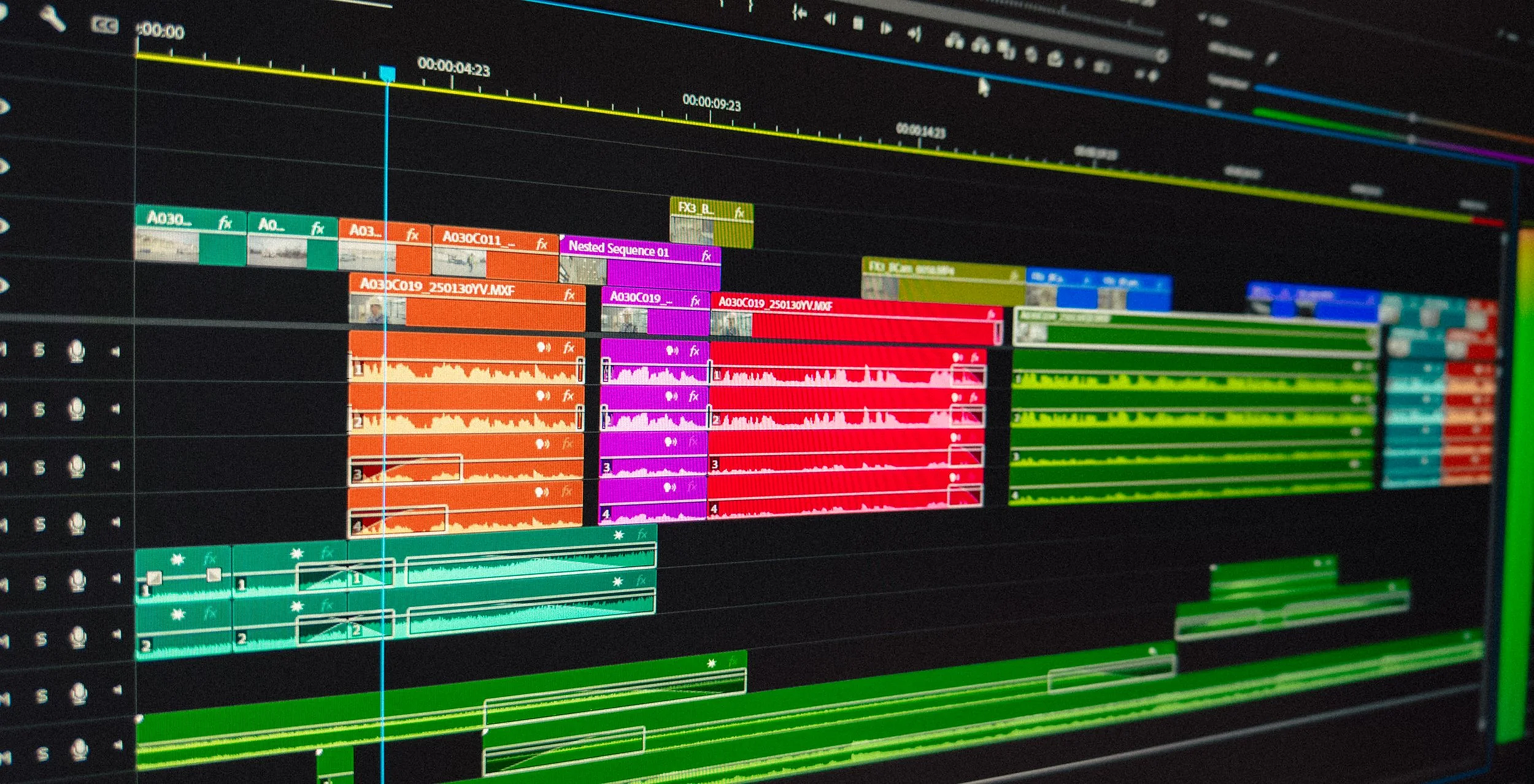 Close-up of a digital screen with a small, blurred logo or icon on the left side, and a textured, cyan background.