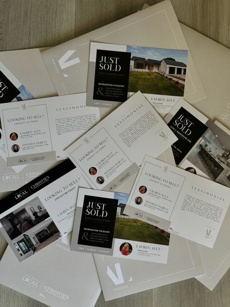 Multiple real estate flyers and business cards for a property sale, featuring photos of houses and contact information.