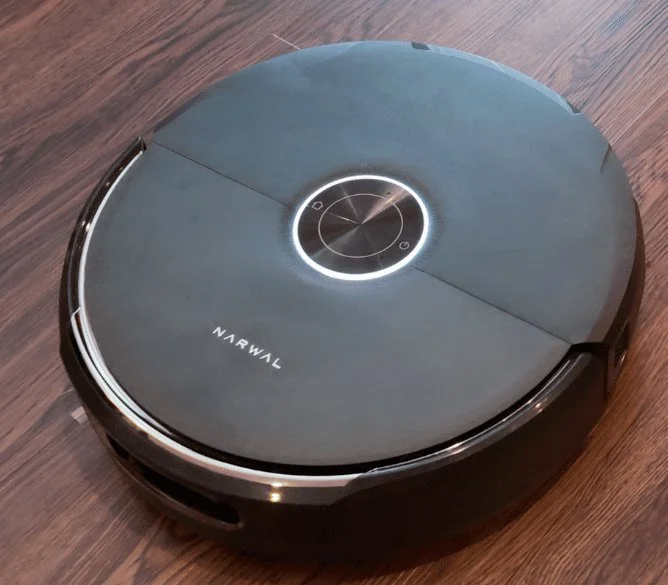 Narwal Flow 2 robot vacuum and mop on a hardwood floor