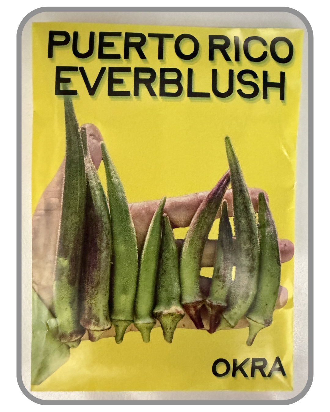 A collection of twelve heirloom seed packet images featuring vegetables grown by farmers and seed stewards in Western North Carolina. Each packet displays a close-up photograph of the crop variety and its name. The varieties include Blue Goose Southe