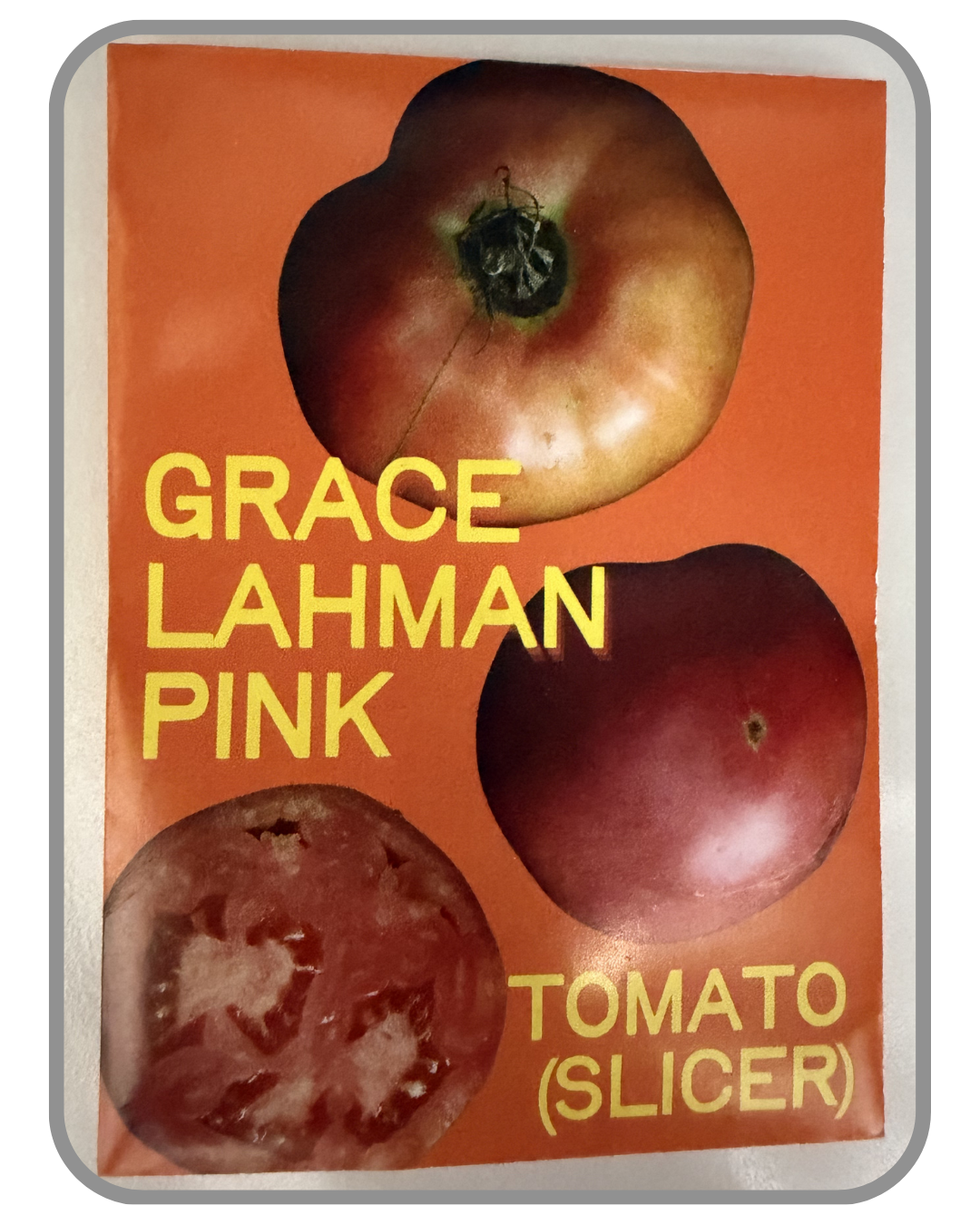 A collection of twelve heirloom seed packet images featuring vegetables grown by farmers and seed stewards in Western North Carolina. Each packet displays a close-up photograph of the crop variety and its name. The varieties include Blue Goose Southe