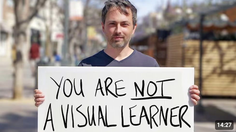 Thumbnail of man holding sign that says, "You Are Not a Visual Learner."