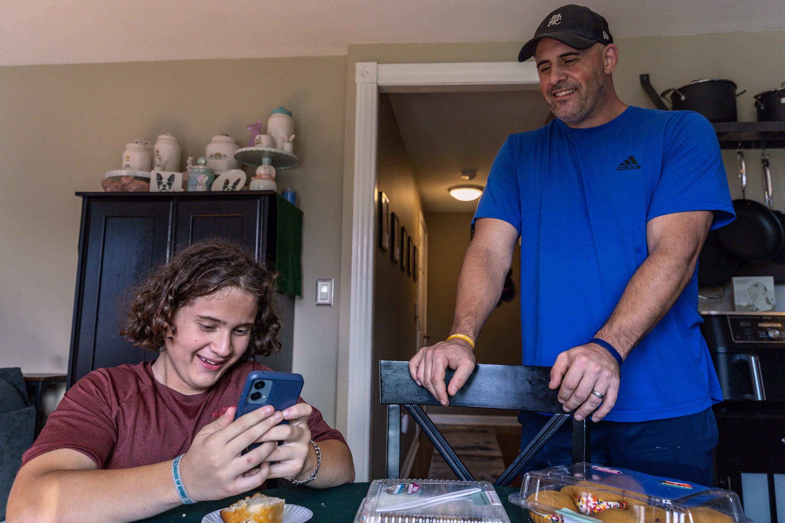 Jamie and Myles share a laugh over a photo of Myles’ hair from a recent hockey game.
From the moment Myles was born, he and Jamie have shared a unique bond. The two can only describe their relationship as “untraditional,” moving beyond the tradition