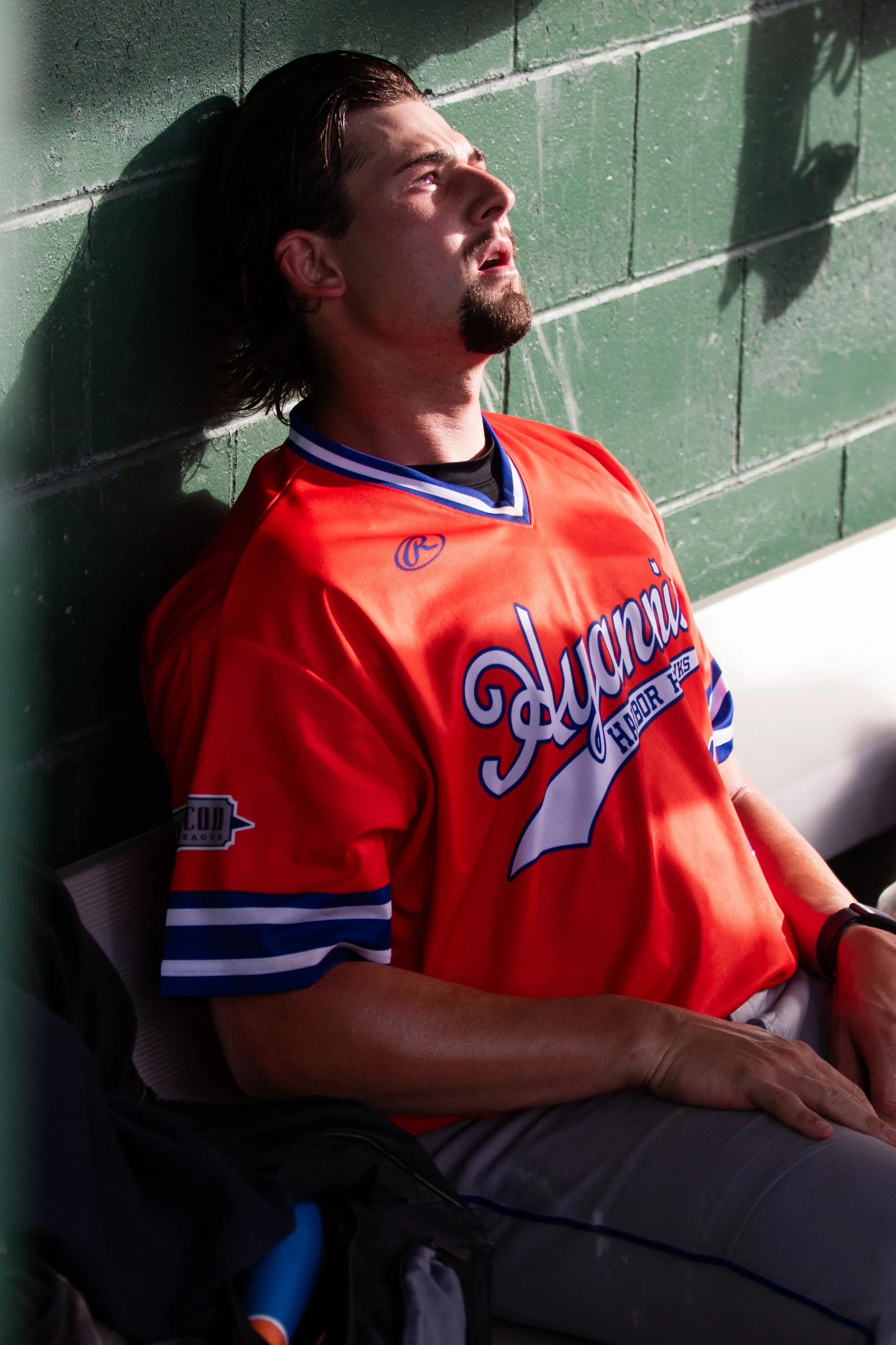 Hyannis pitcher Zach Voelker slumps in the dugout after an inning on the mound against the Cape Cod Baseball League’s Wareham Gateman on July 9, 2023, in Wareham, Mass.
