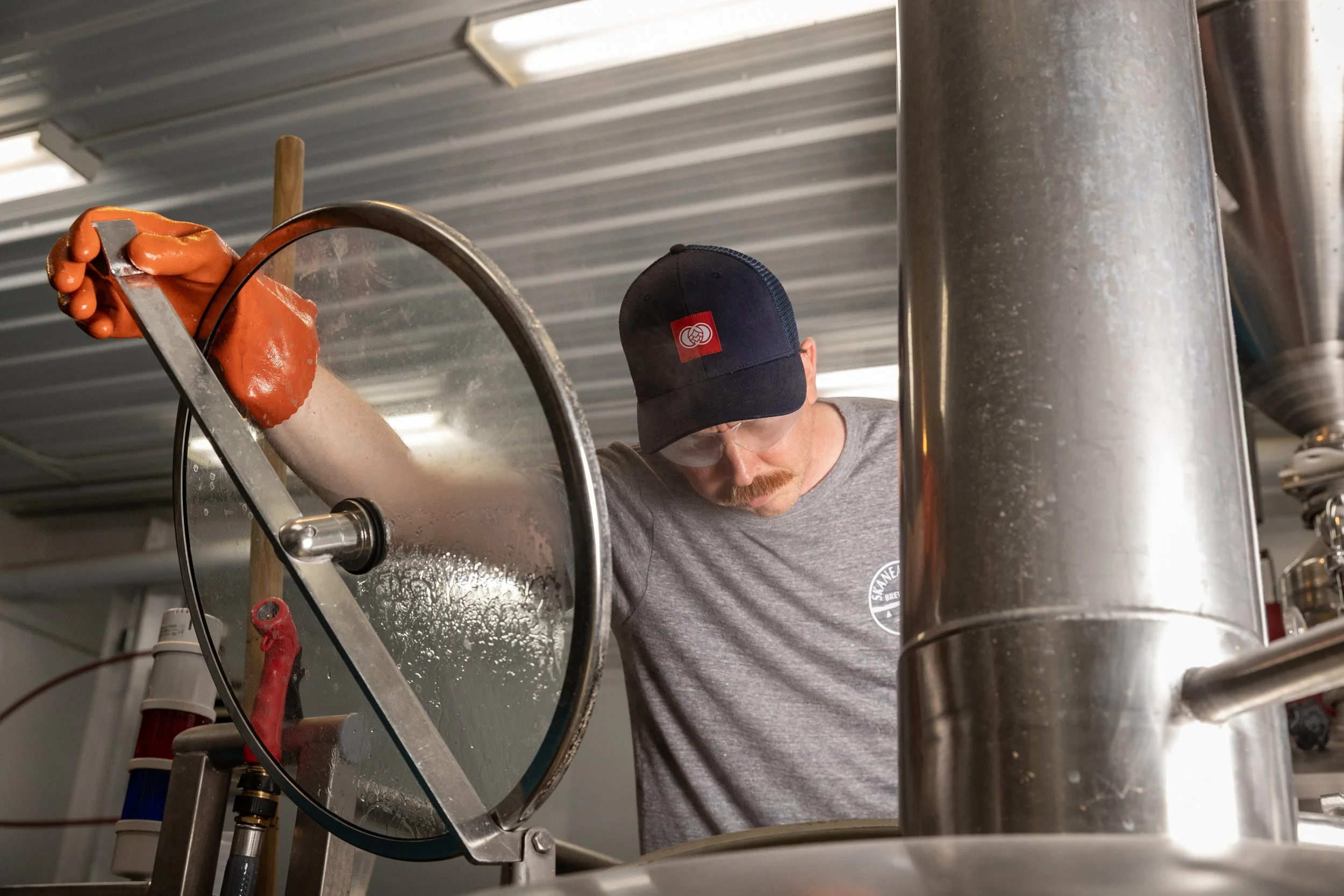  Brewer Chris Watson spends a quiet Friday morning brewing a batch of IPA at Skaneateles Brewery. A former musician and medical professional, Watson joined the brewery four weeks ago, taking the next step in turning his passion for beer into a profes