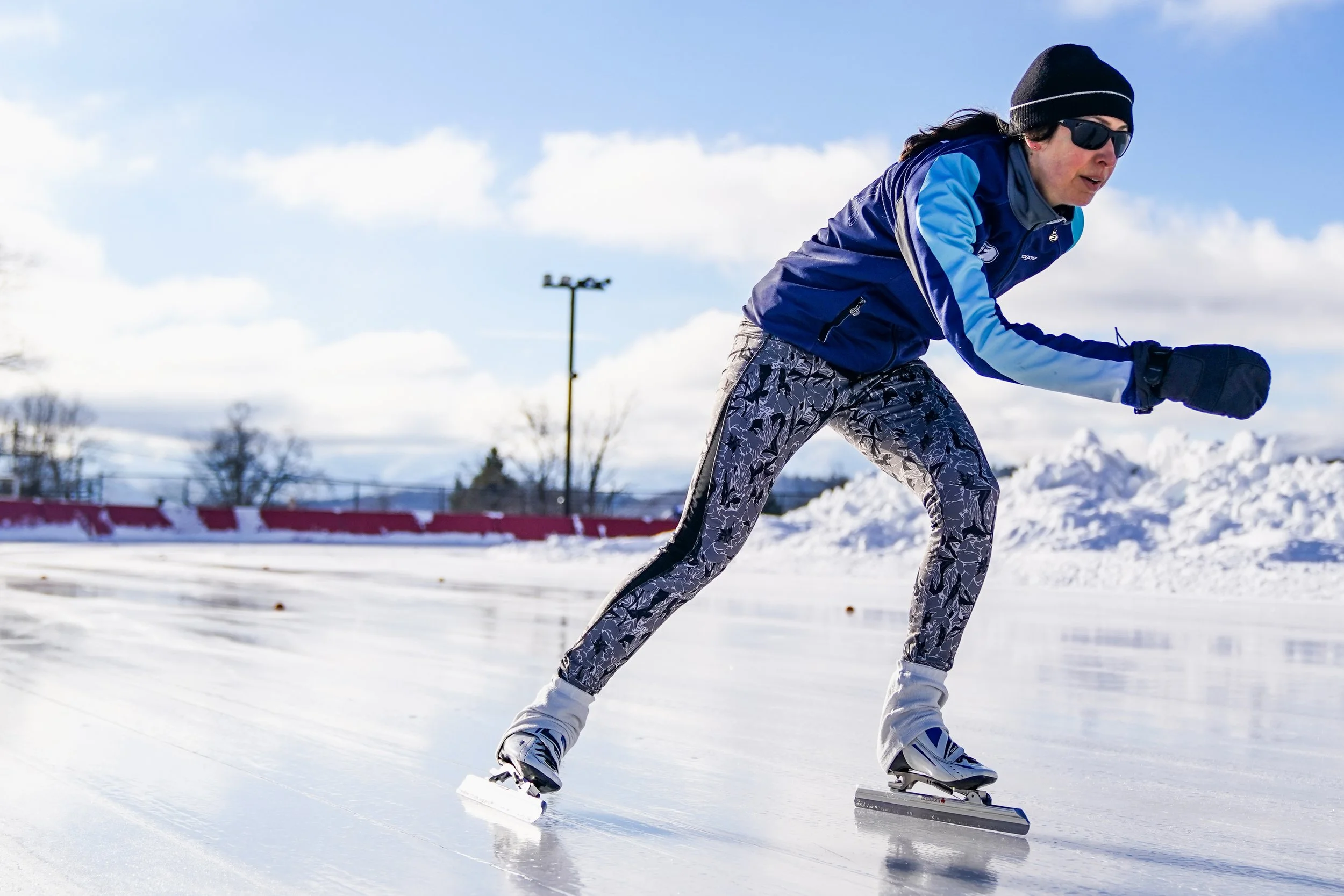 An outdoor speedskating athlete races on the Olympic Speed Skating Oval during the Empire State Winter Games in Lake Placid, N.Y., on Saturday, Feb. 3, 2024.