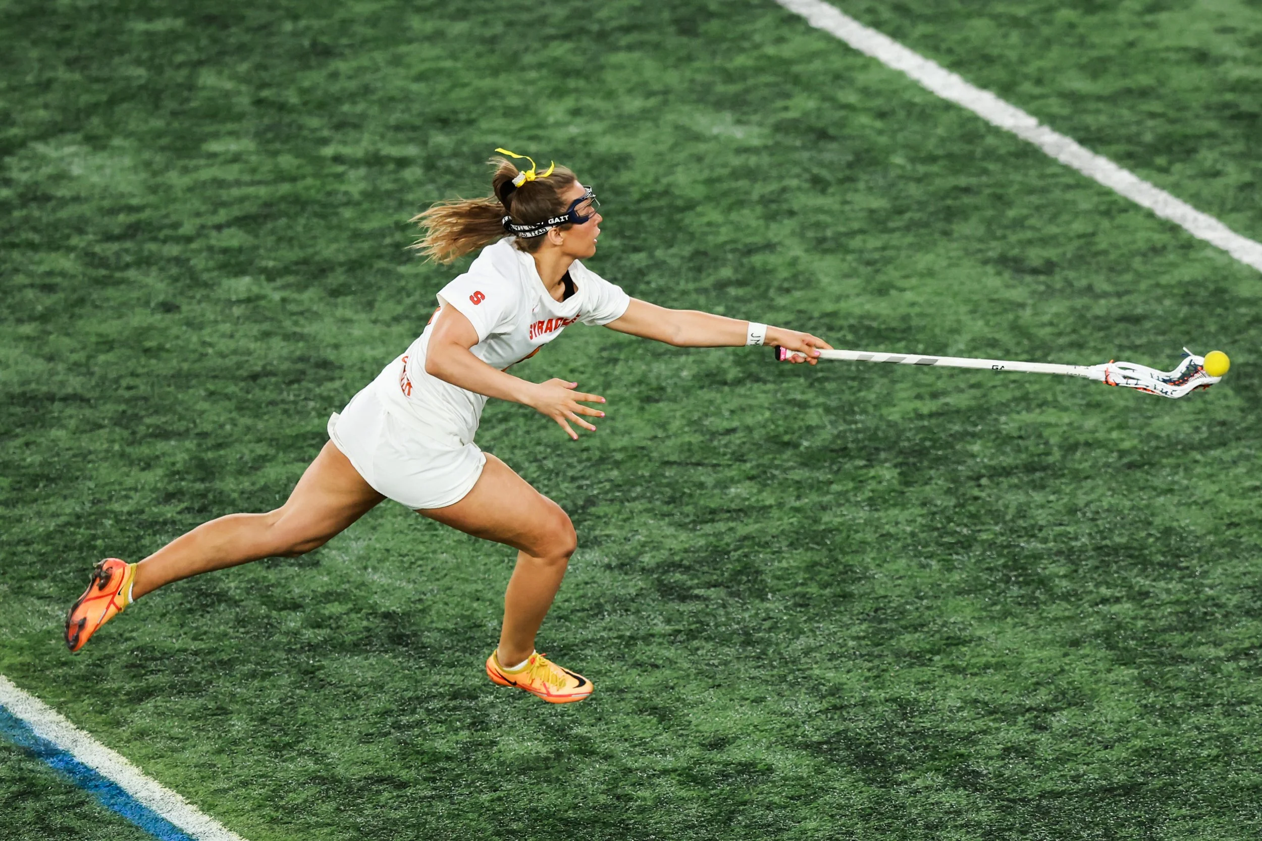 Syracuse lacrosse' s Mileena Cotter (47) lunges to catch a pass during the Orange’s 13-3 win over California-Berkeley on March 3, 2026, in Syracuse, N.Y.