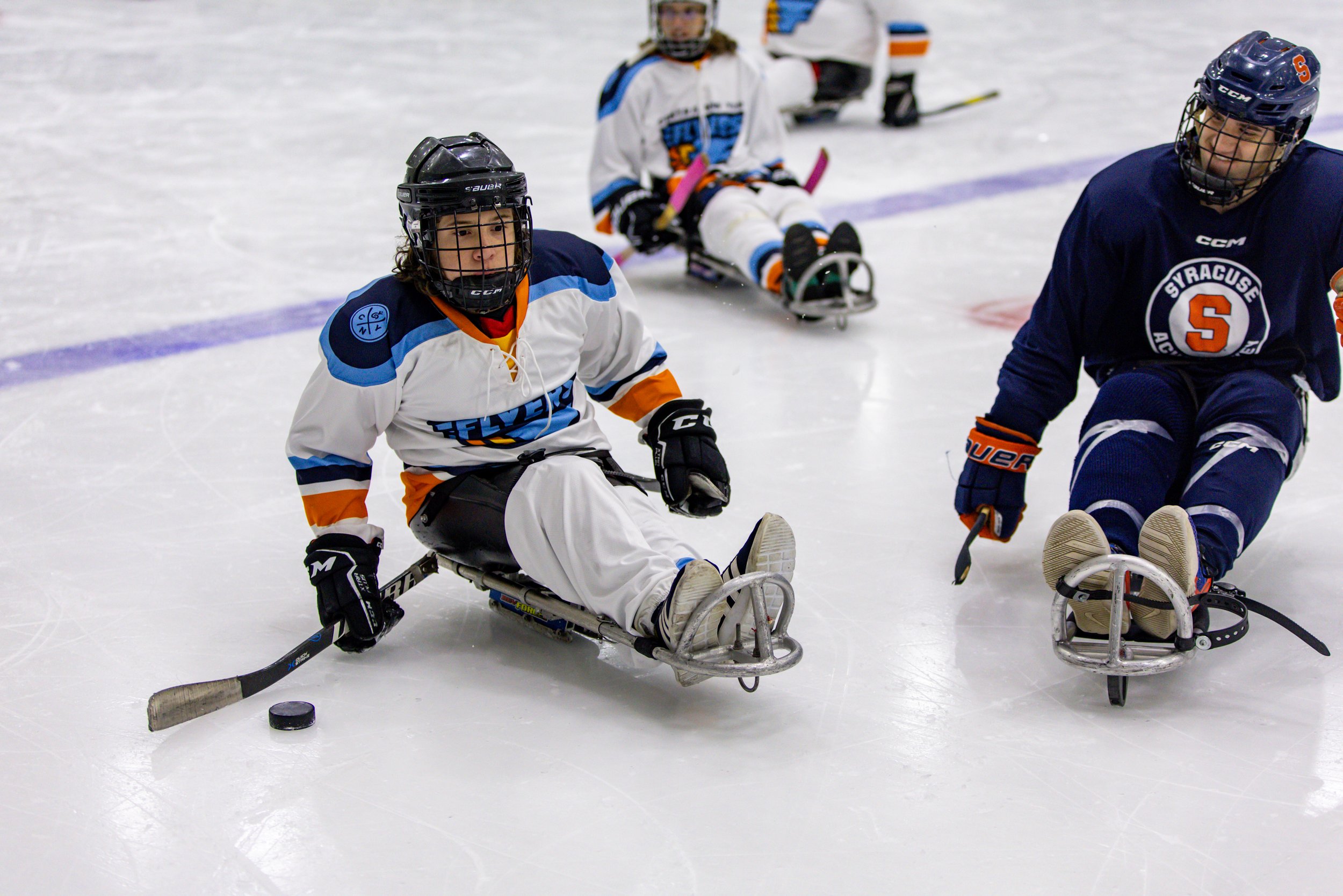 Myles competes with the CNY Flyers in their annual charity match against the Syracuse University men’s club hockey team.
The team offers Myles more than an opportunity to play a sport. It provides him and others a space to grow as individuals. Throu