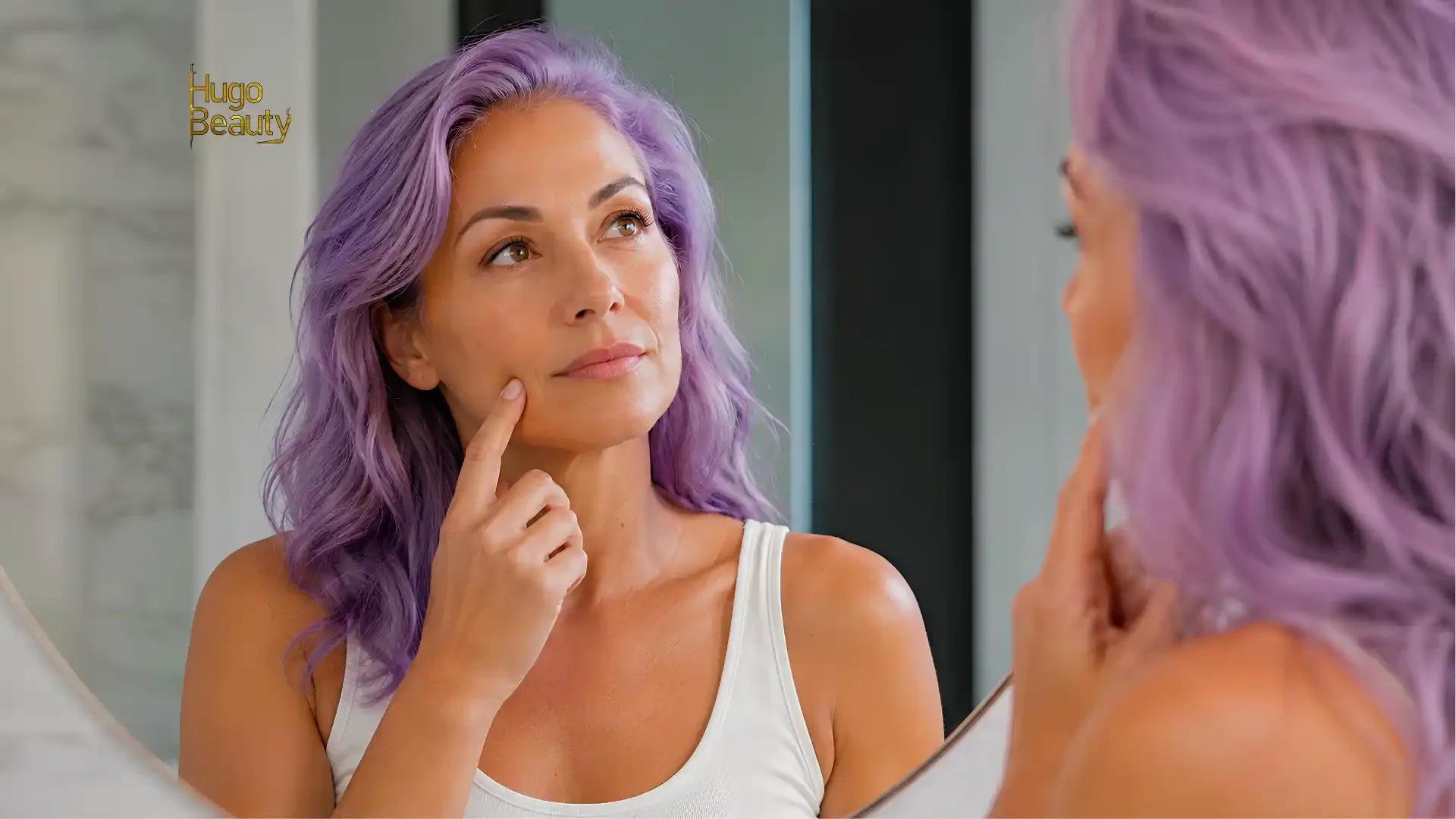 Woman before treatment: Woman with lavender hair examining her cheek in a mirror before HIFU at Hugo Beauty HCMC.