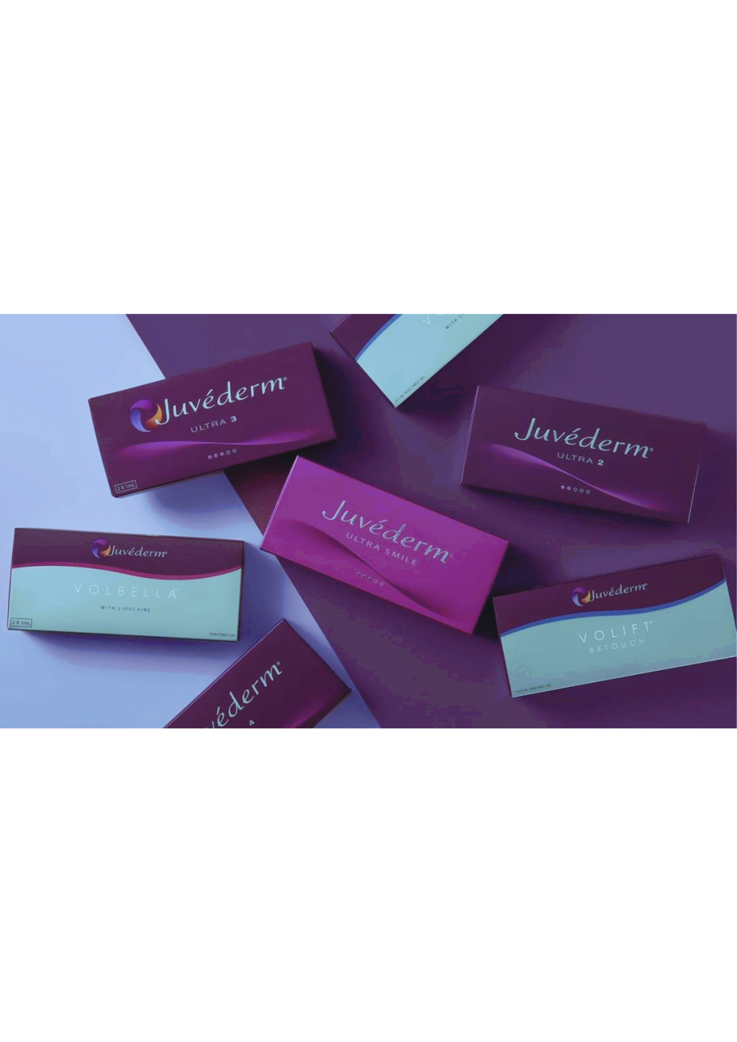 Multiple boxes of Juvéderm skincare products, including Ultra 2, Ultra 3, Volbella, and Volift, scattered on a surface.