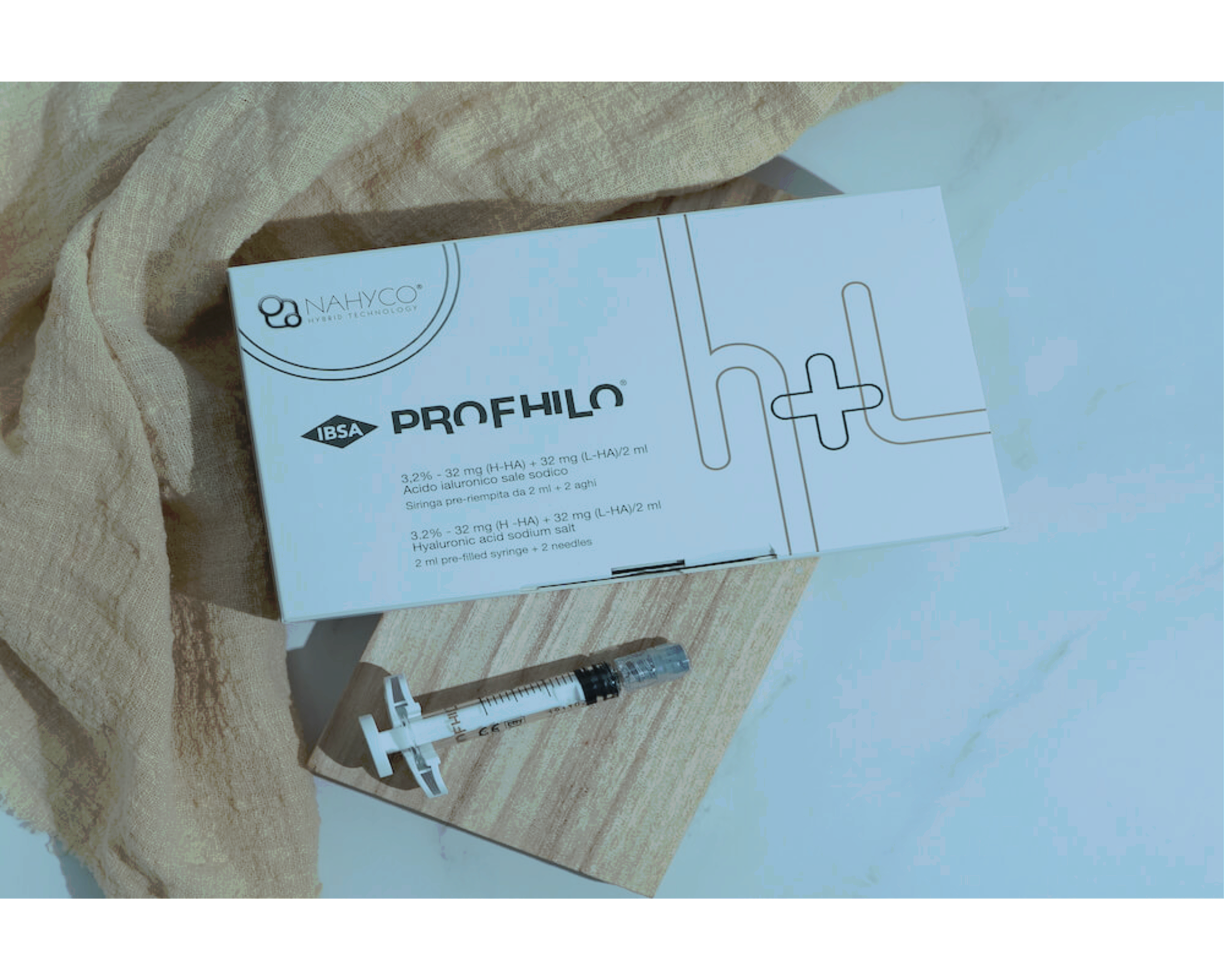 A box of Hyaluronic Acid filler from NAYHO, with a syringe and needle beside it, placed on a wooden surface with a beige fabric underneath.