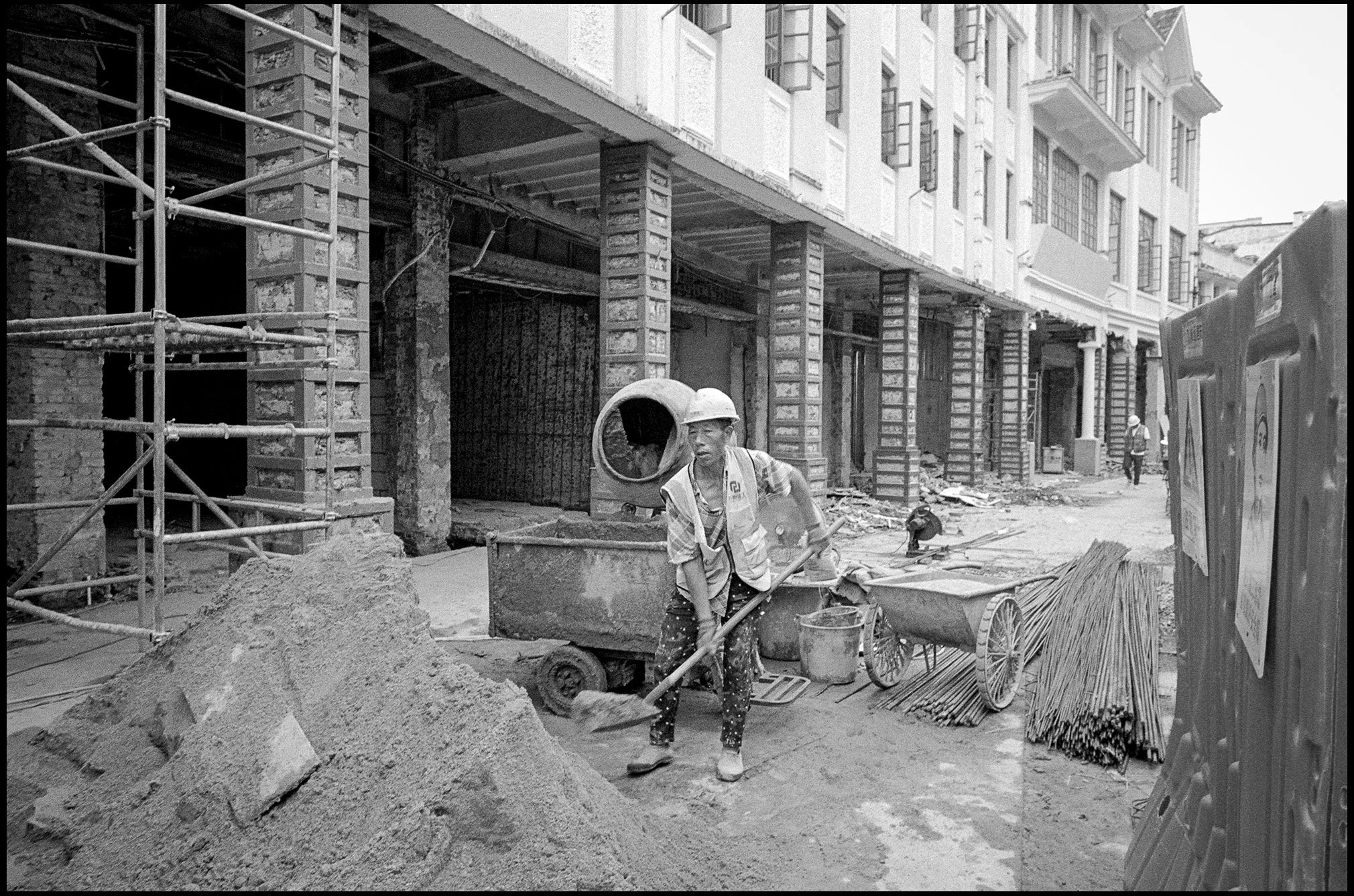 Labourer Mixing Mud, Guangdong Province, China 2025