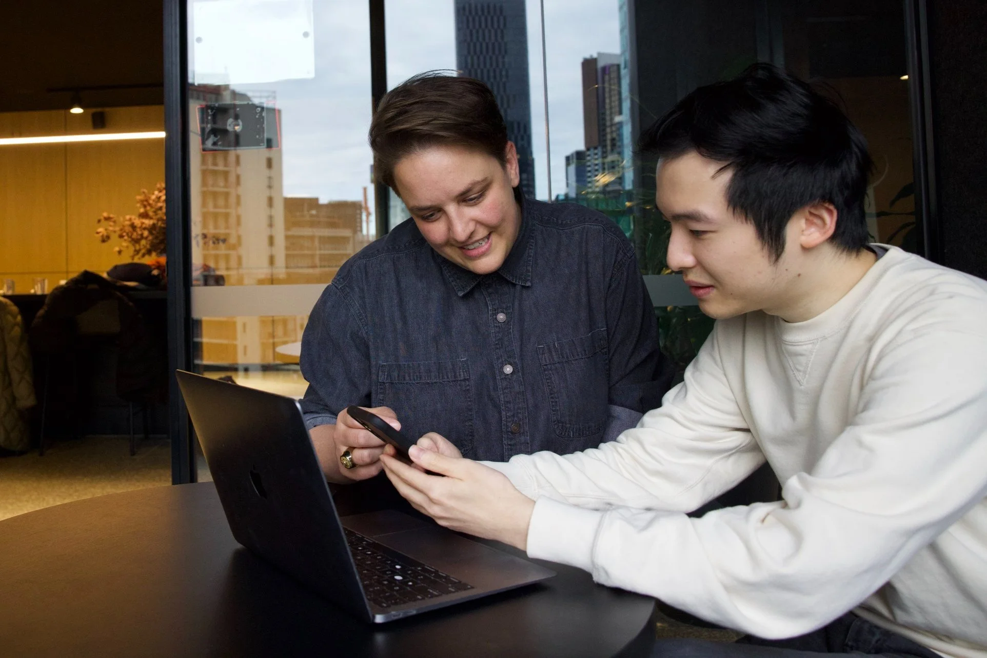 Career Coach Sadie Said sitting with a student