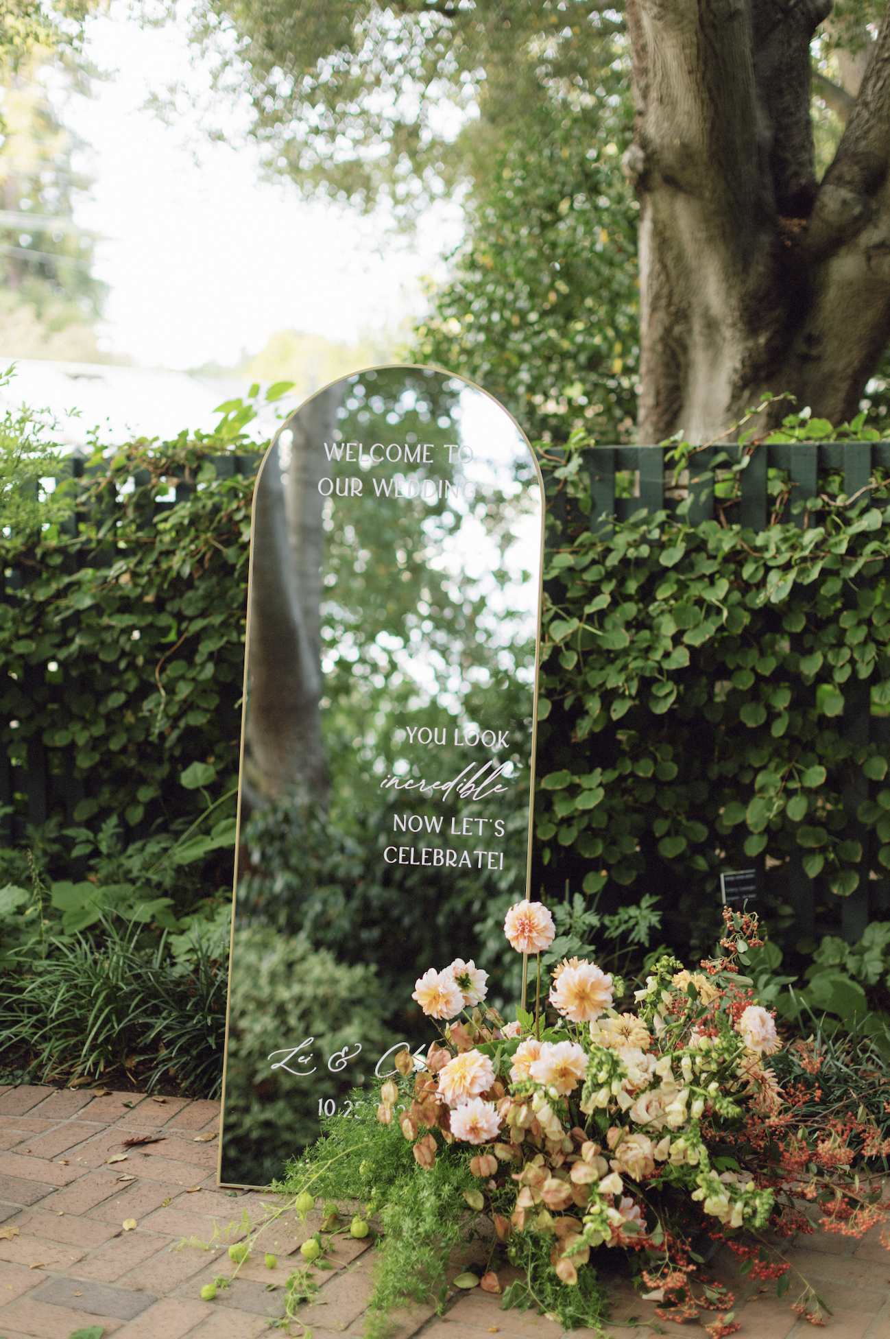 Gold Arch Mirror for Welcome Sign in Garden Wedding