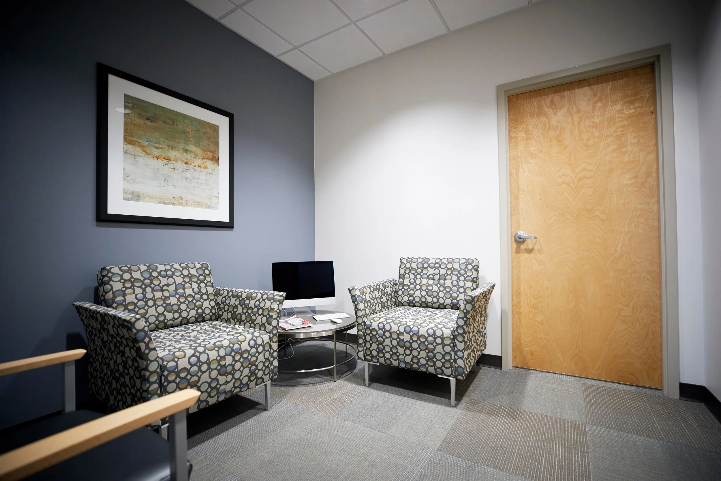 Tidy waiting room with seating area maintained by ProClean Services of South Brevard’s commercial cleaning team.