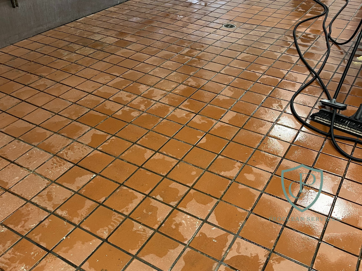 Shiny, clean commercial restaurant kitchen floor after professional post-construction cleaning