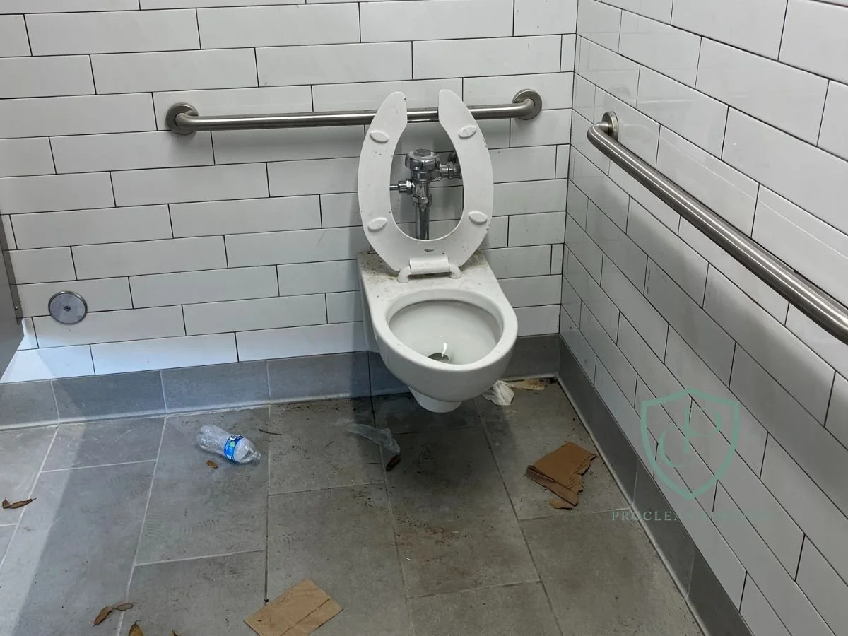 Commercial bathroom stalls before post-construction cleaning at office site