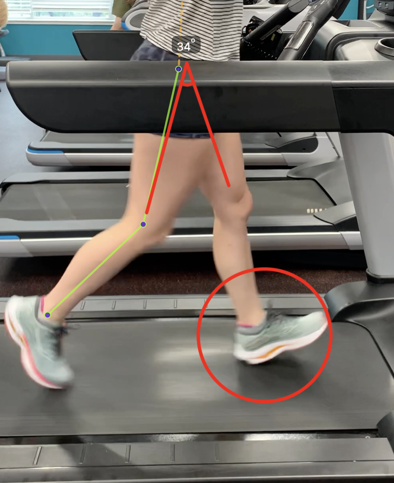Coach Justin Roeder analyzing this runners biomechanics