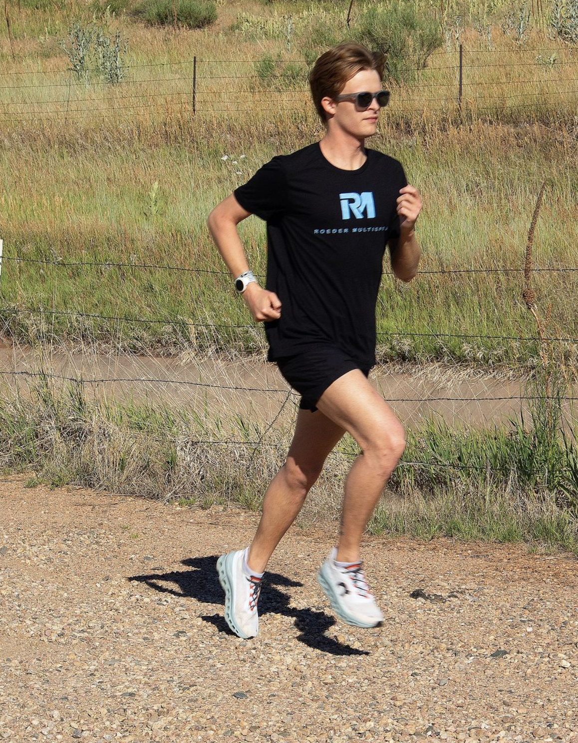 Andrew "AJ" Whitinger running soft surface trails in Colorado