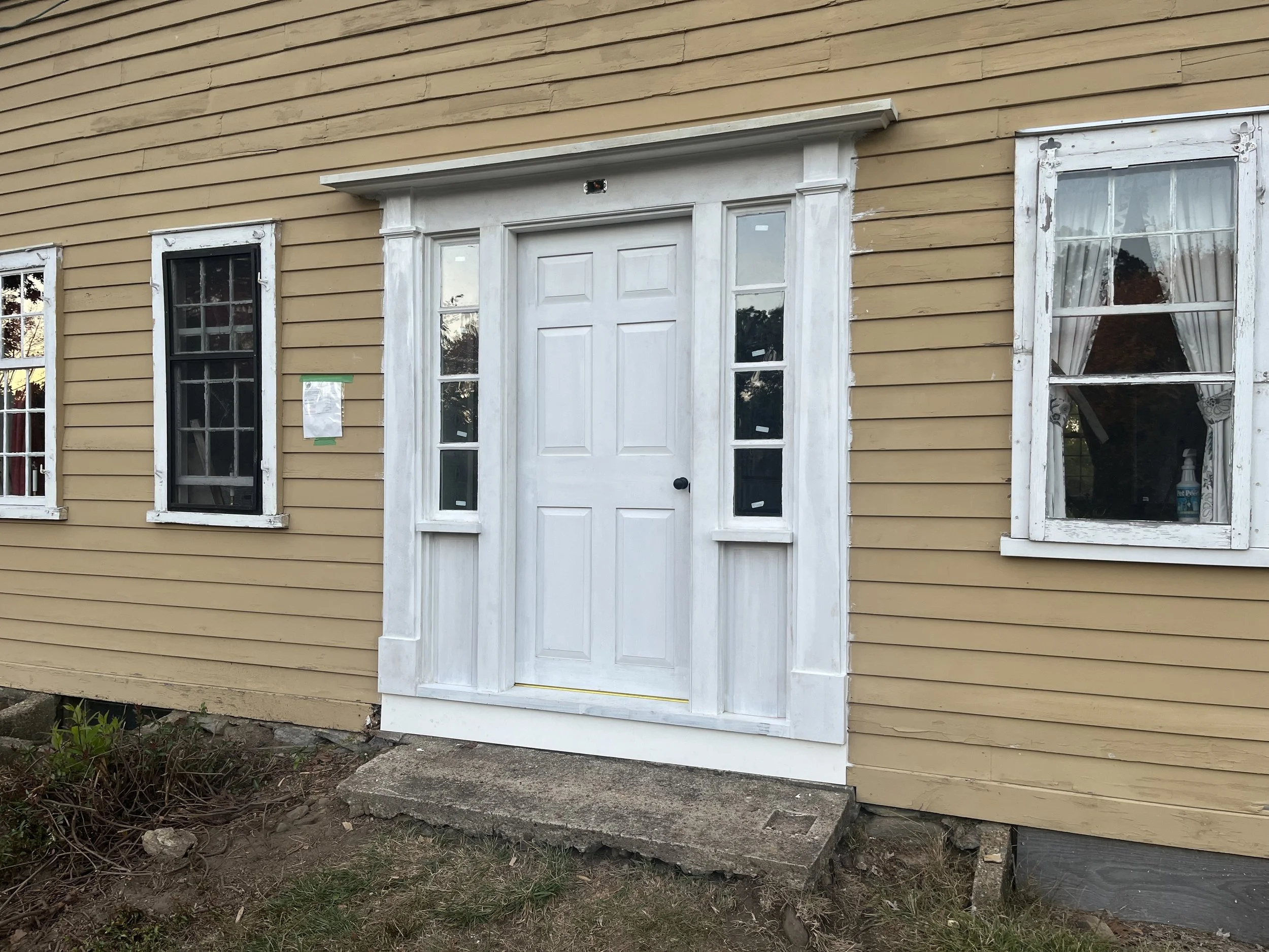 Replacement front door and surround for early 1700s home.