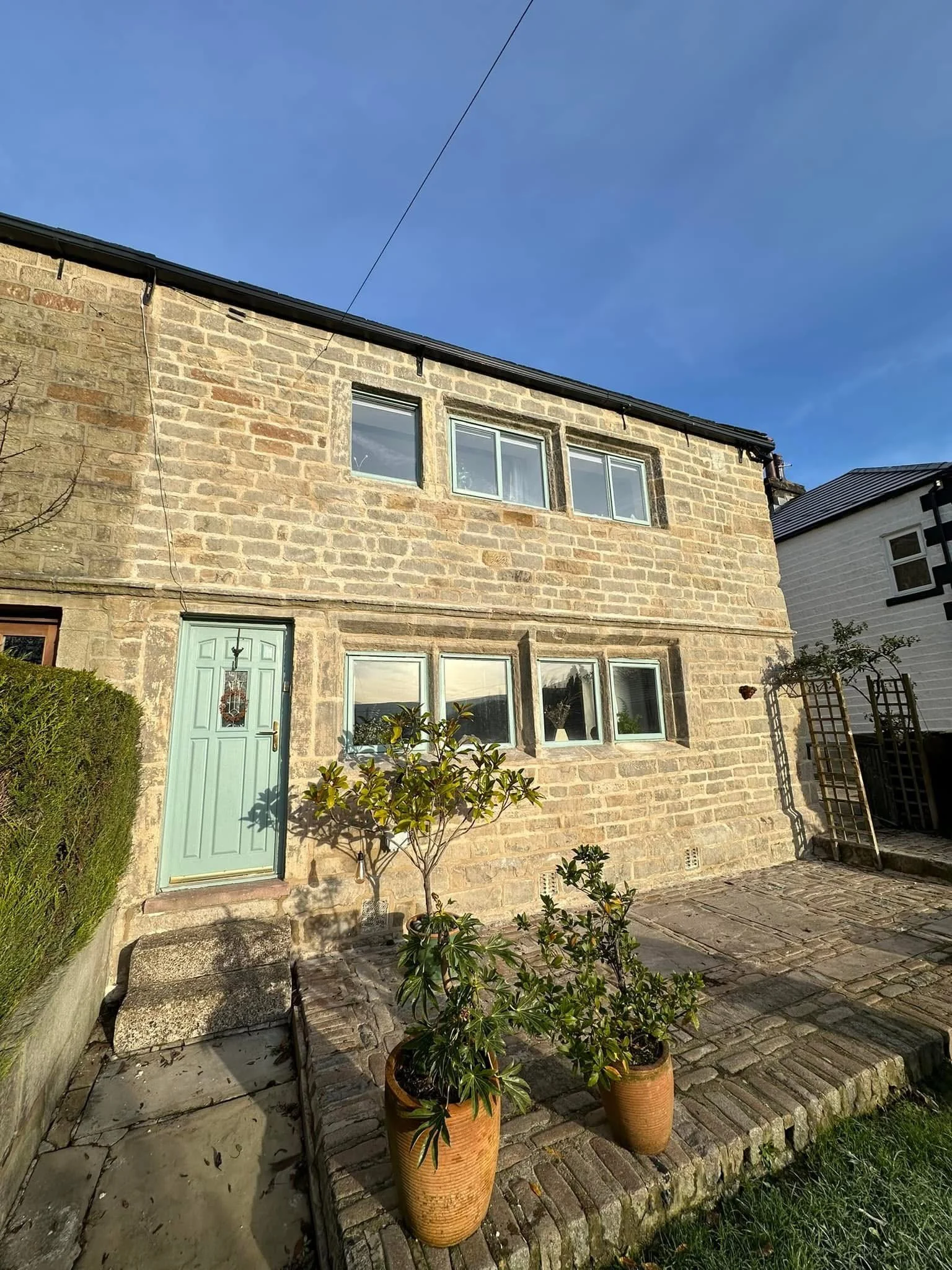 Heritage repointing using traditional lime mortar to historic stonework in Calderdale.