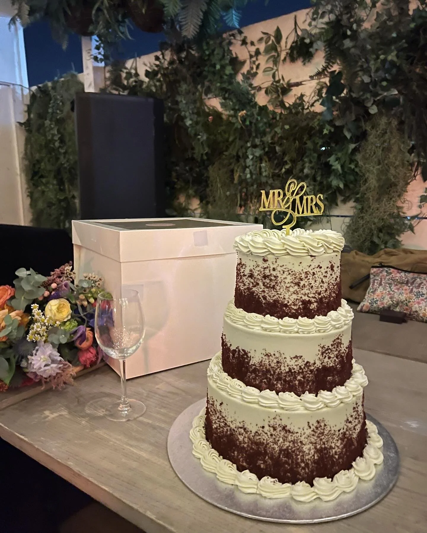 Laurie’s customers, Fernando and Kate embracing by the lake on their wedding day.