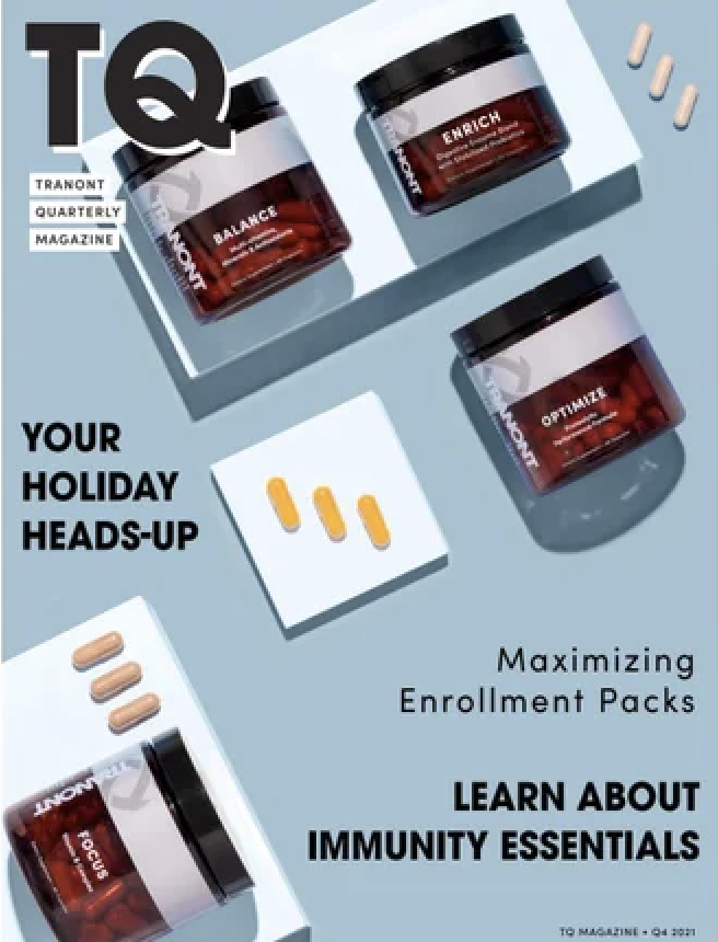 The cover of a health supplement magazine titled 'TQ' featuring containers of dietary supplements labeled 'Balance,' 'Enhance,' and 'Optimize,' along with capsules and tablets, emphasizing immune support and maximizing enrollment packs for the holida