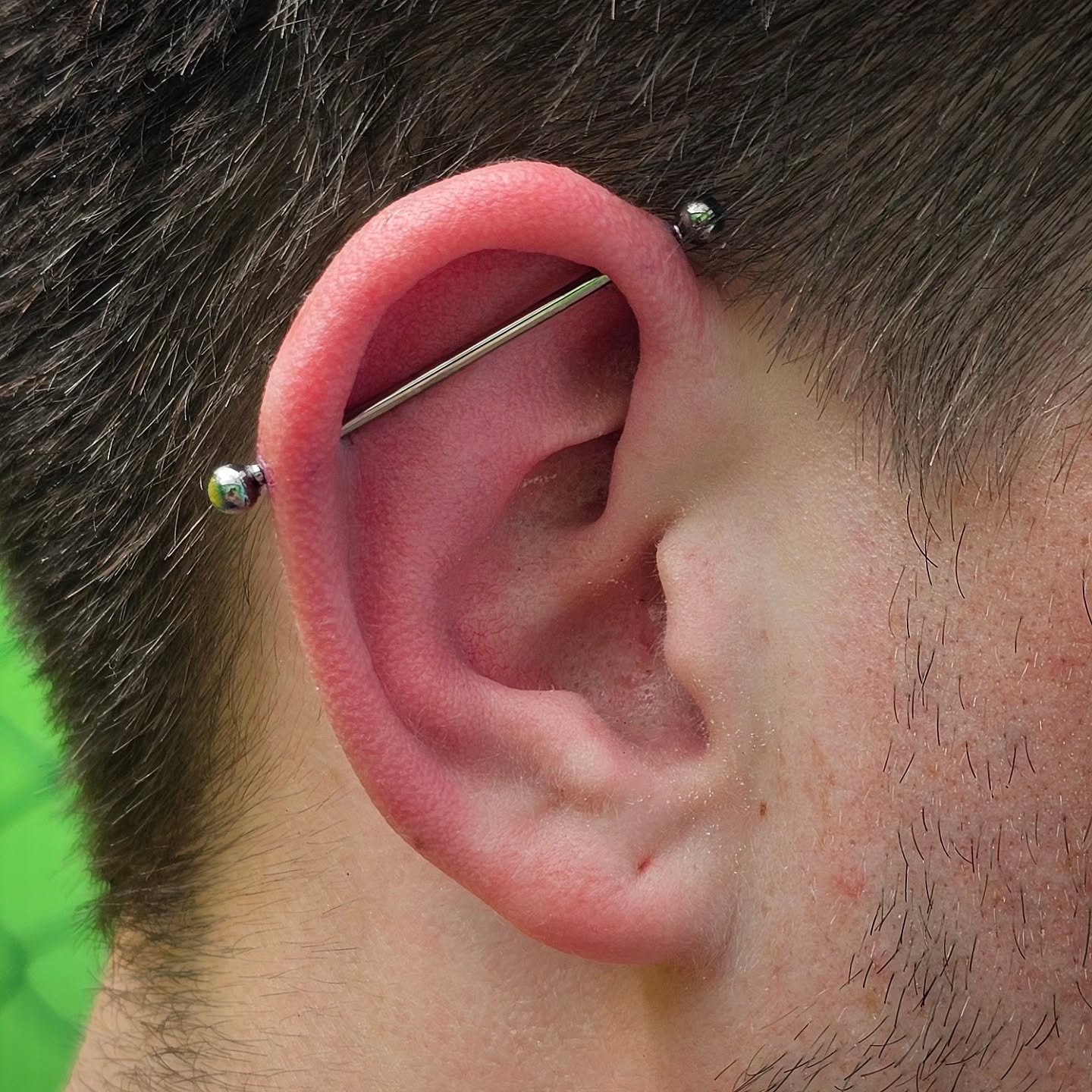 Double the holes, double the fun 😉😎
This fresh #industrialpiercing features a #14gauge, internally threaded, implant-grade #titanium #barbell &amp; balls ends from @junipurrjewelry &mdash; safe, secure, and made to last ✨️🔩
.
.
.
#legacytattoovi #