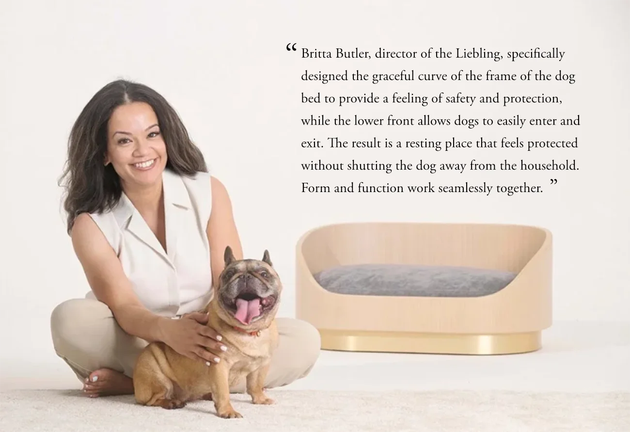 Britta sitting with pet dog and bed with pull quote from article regarding the bed design