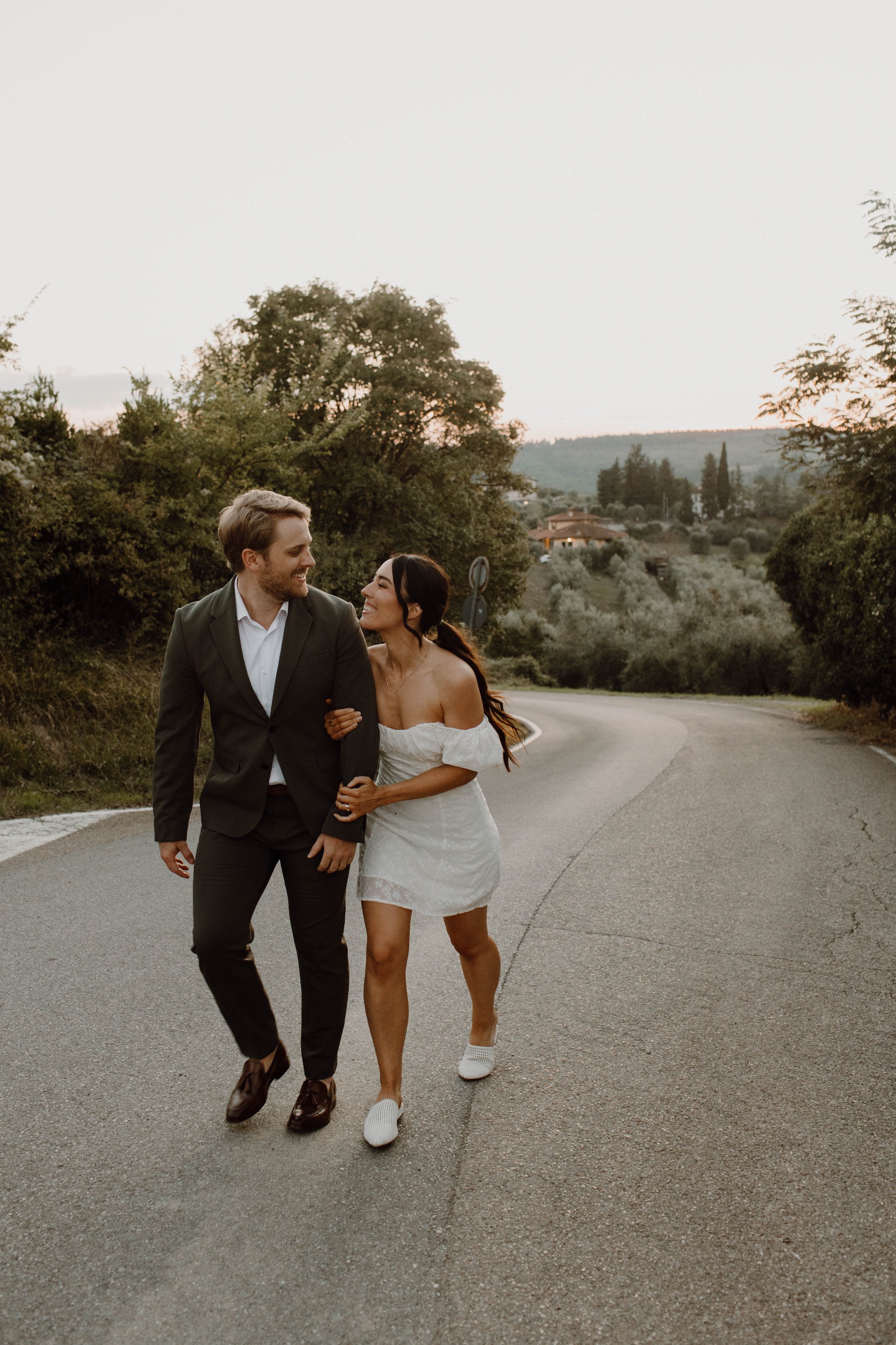 Enjoying each other on the Italian roadside - Italy sunset views - capturing all the in-between moments of this intimate wedding celebration in Florence, Italy.