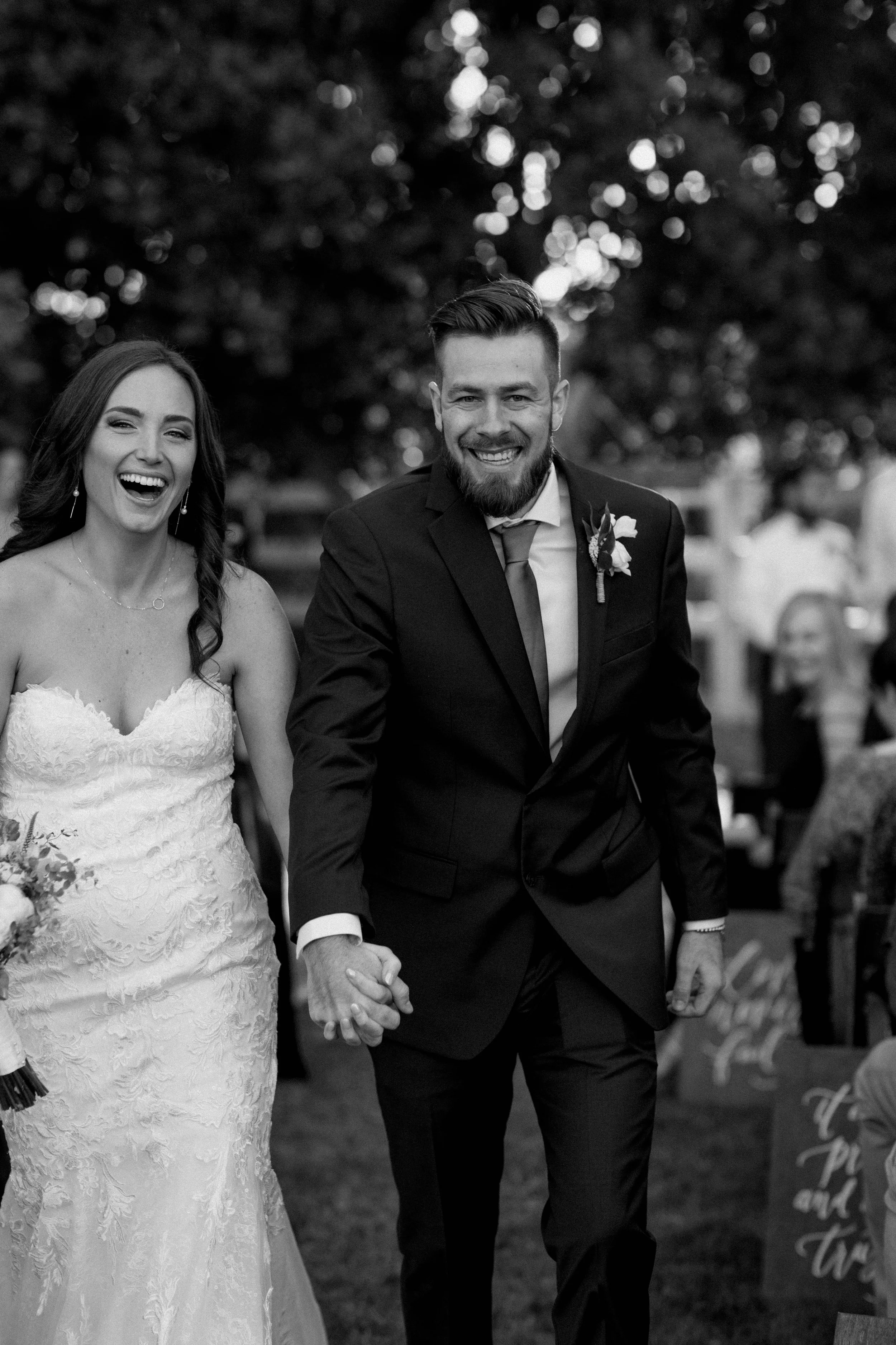 The bride and groom announced as husband and wife for the first time - walking down the aisle - genuine giddiness.