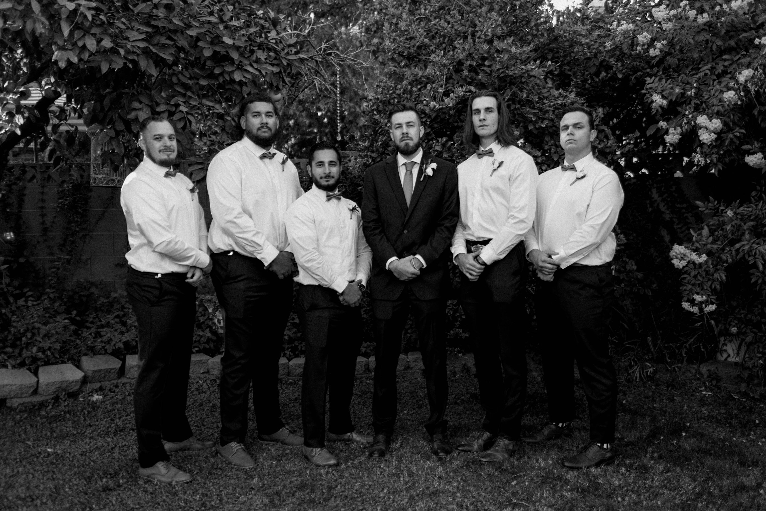 Editorial groomsmen portraits - upscale wedding with intentional simplicity