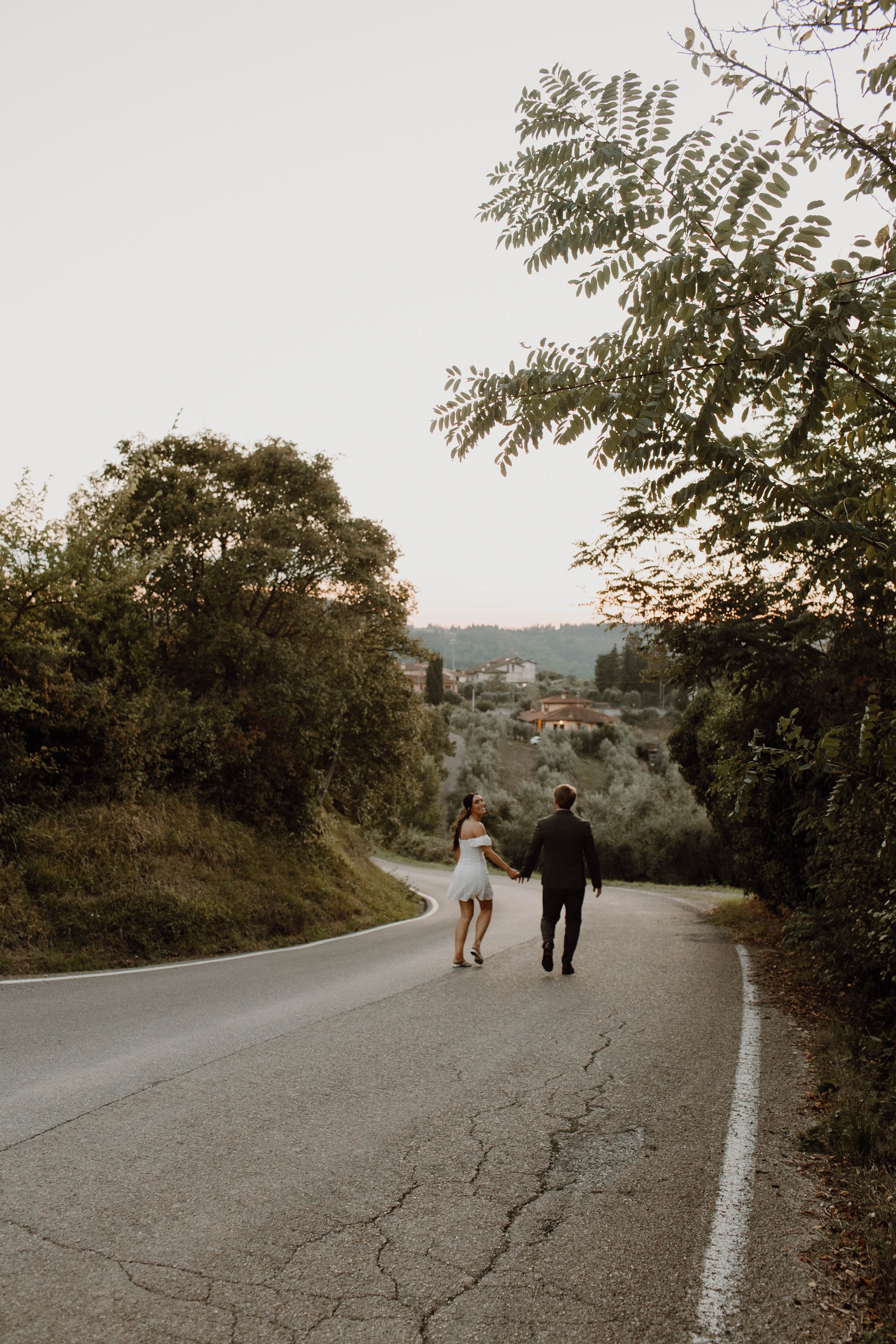 Wide angle view of an Italian Countryside - an intimate wedding celebrating set in Florence, Italy.