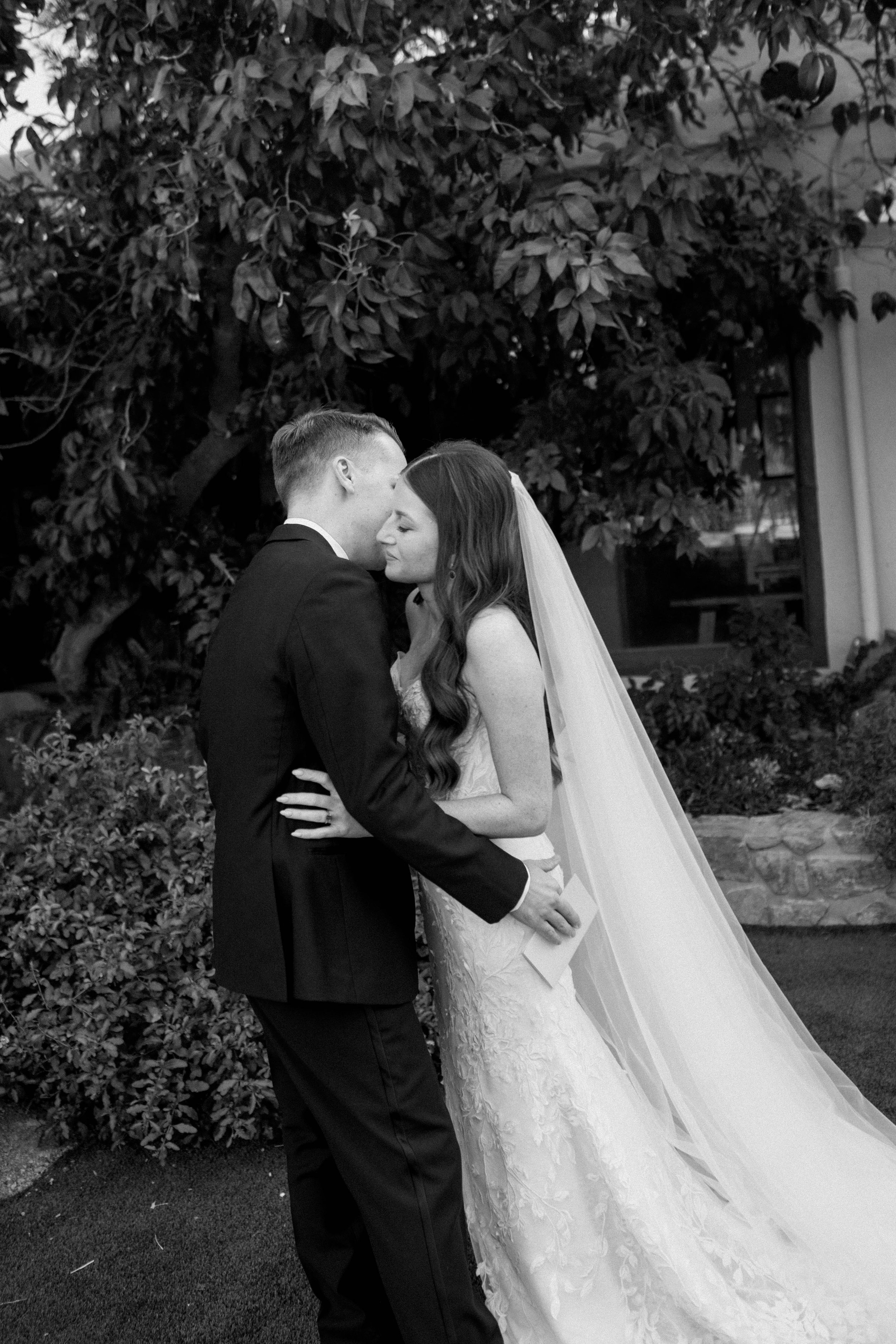 An intimate moment sharing private vows before the ceremony - candid and emotional photography.