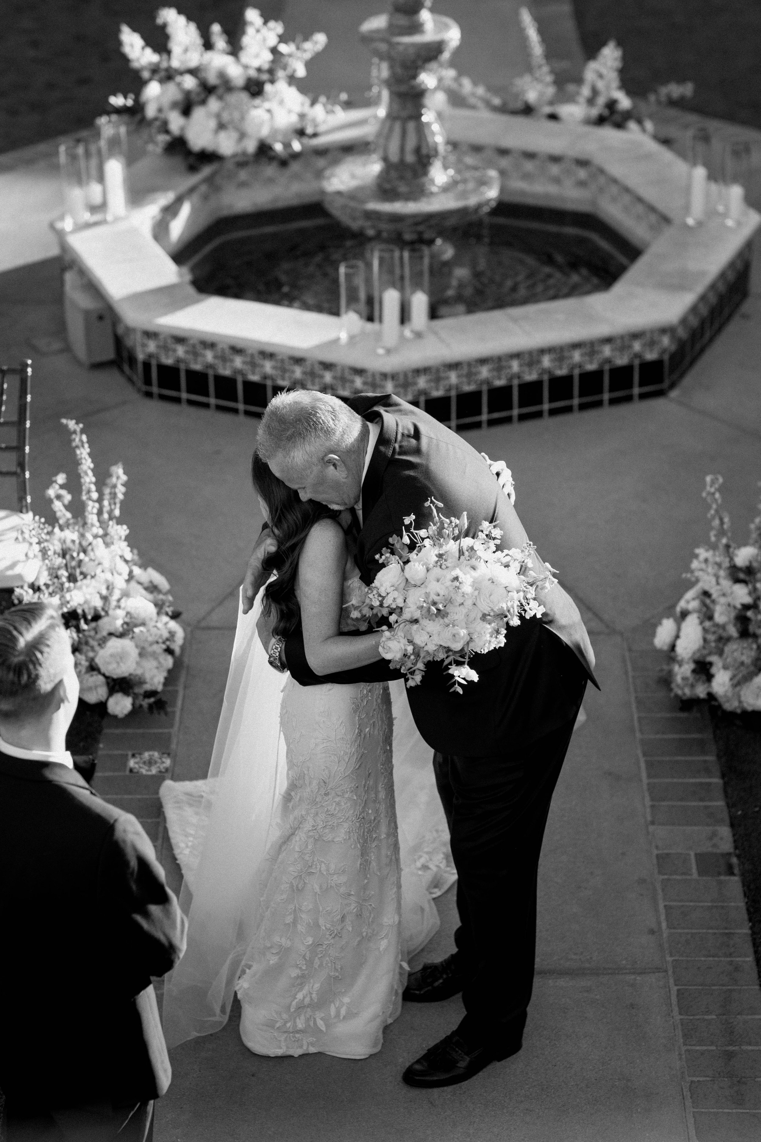 An emotional moment shared with the bride and her father as he's giving her away - captured in a documentary style.