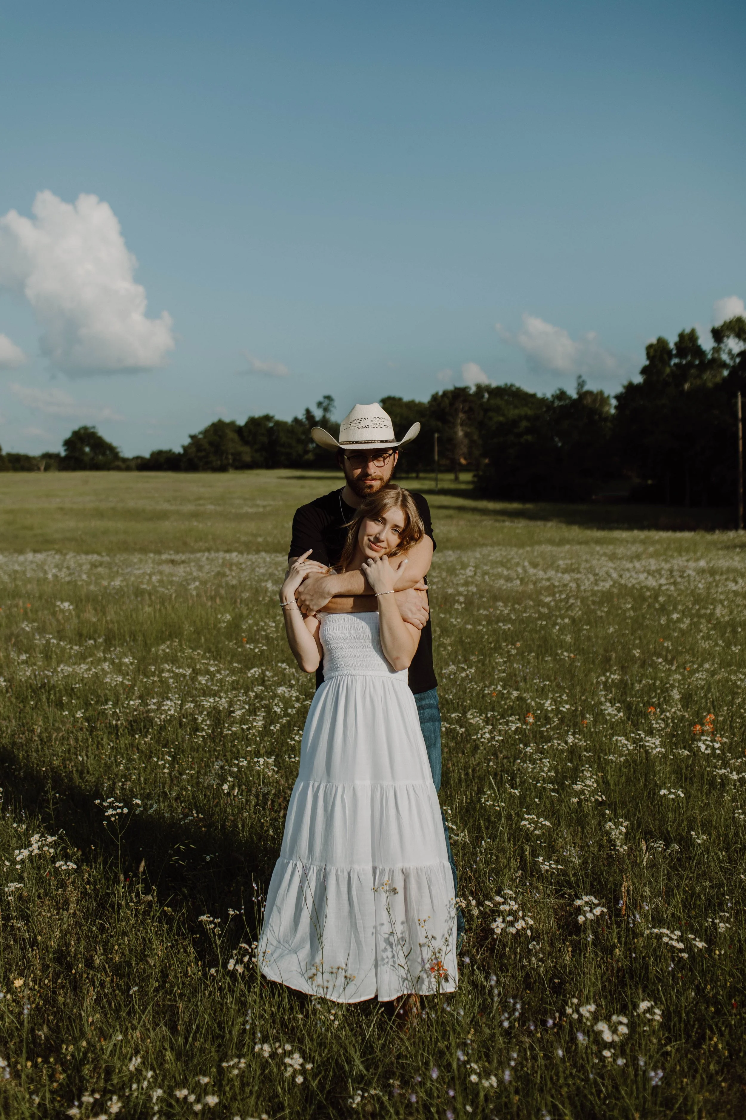 Engaged couple, posing, cowboy at, ranch style - timeless engagement session, laid-back and honest photography.