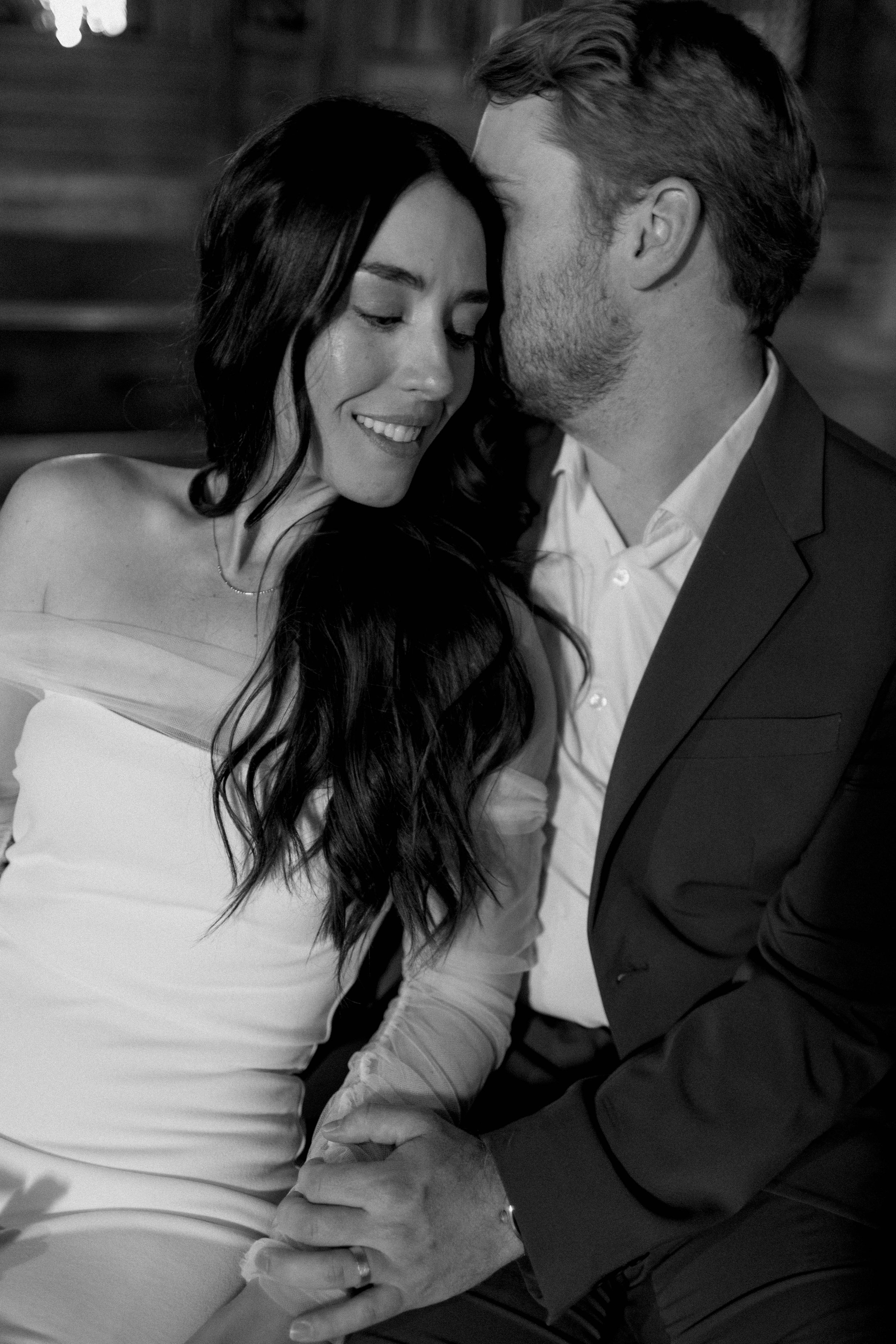 intimate moment between a bride and groom - snuggling up in an Italian church