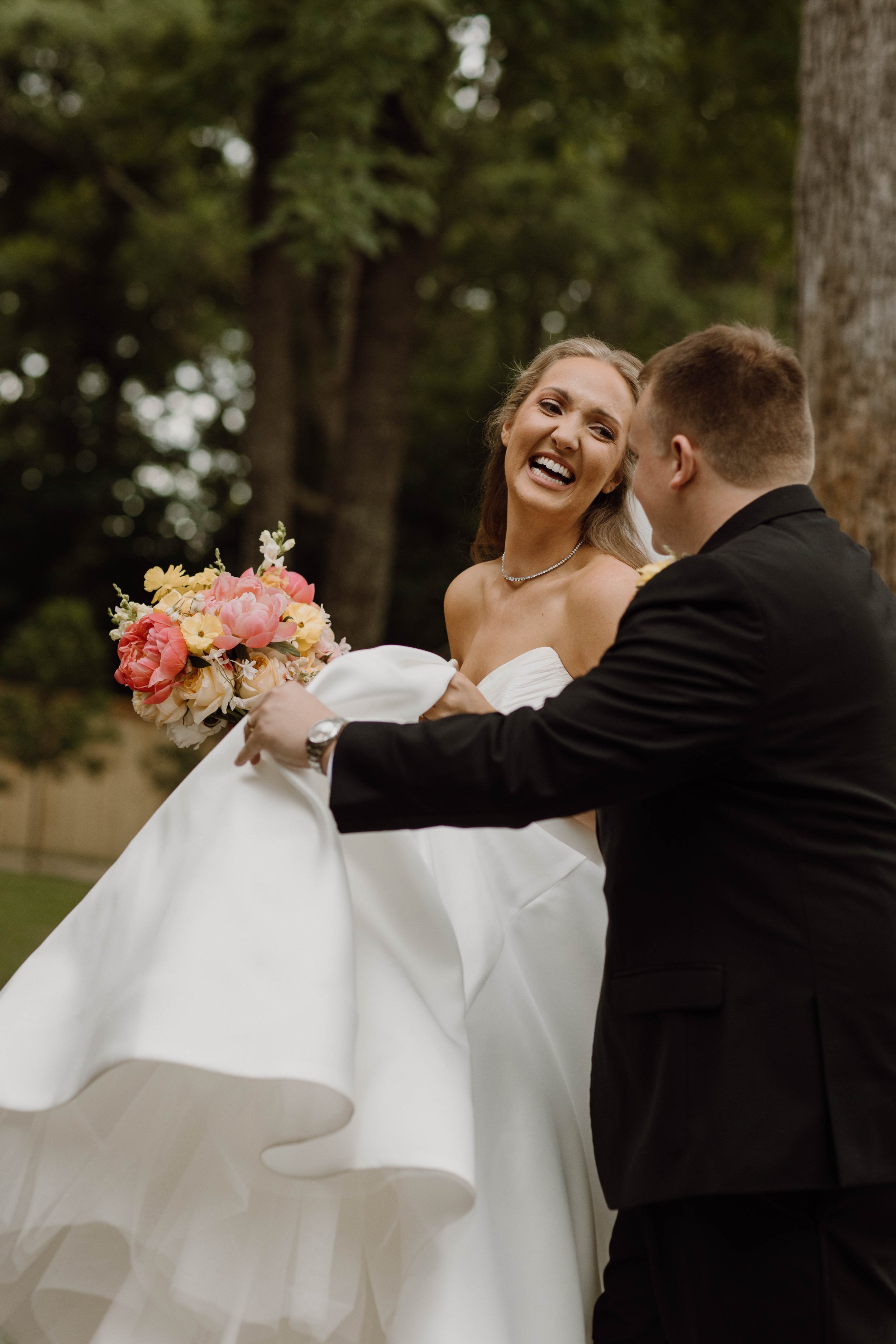 The genuine joy of a bride laughing with her groom - the in-between moments are authentic and timeless.